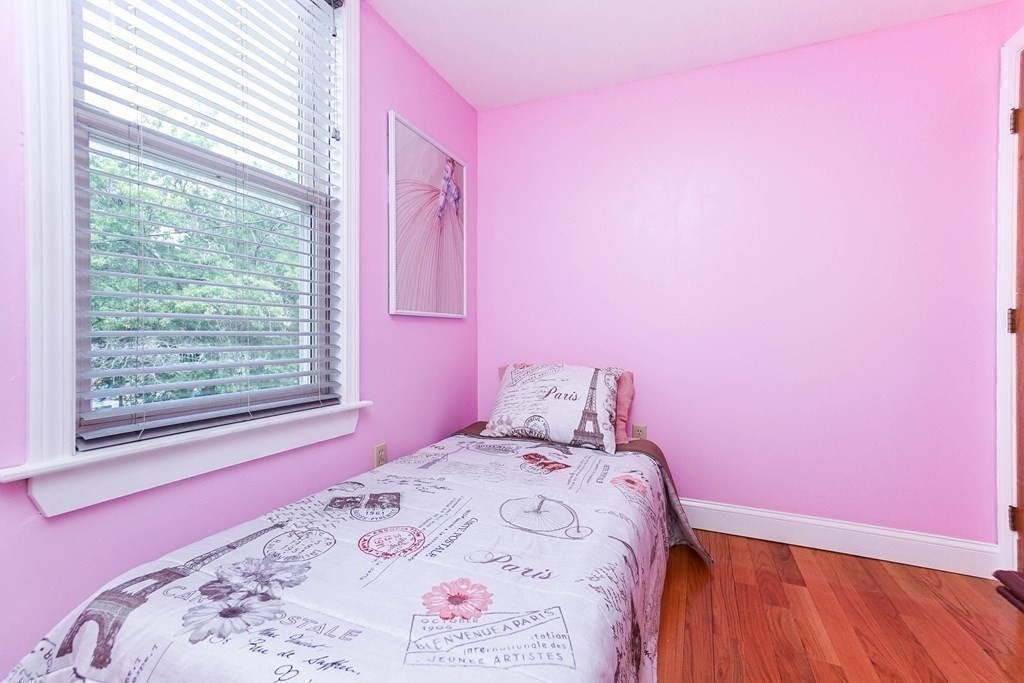 291 Carter Street Chelsea, MA 02150 - Photo 27 of 40 a bedroom with a bed and a window