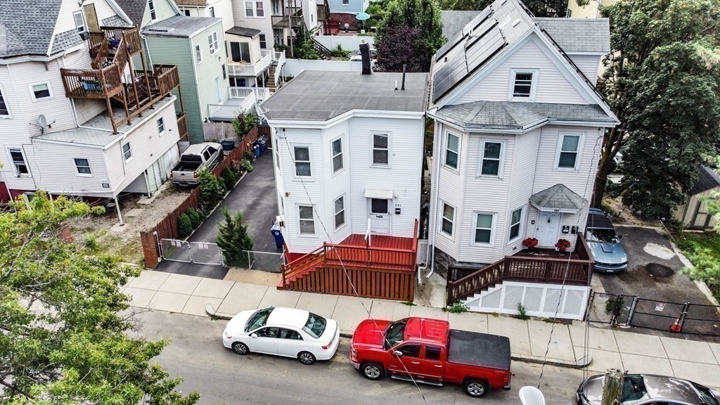 291 Carter Street Chelsea, MA 02150 - Photo 3 of 40 a car parked in front of a white house