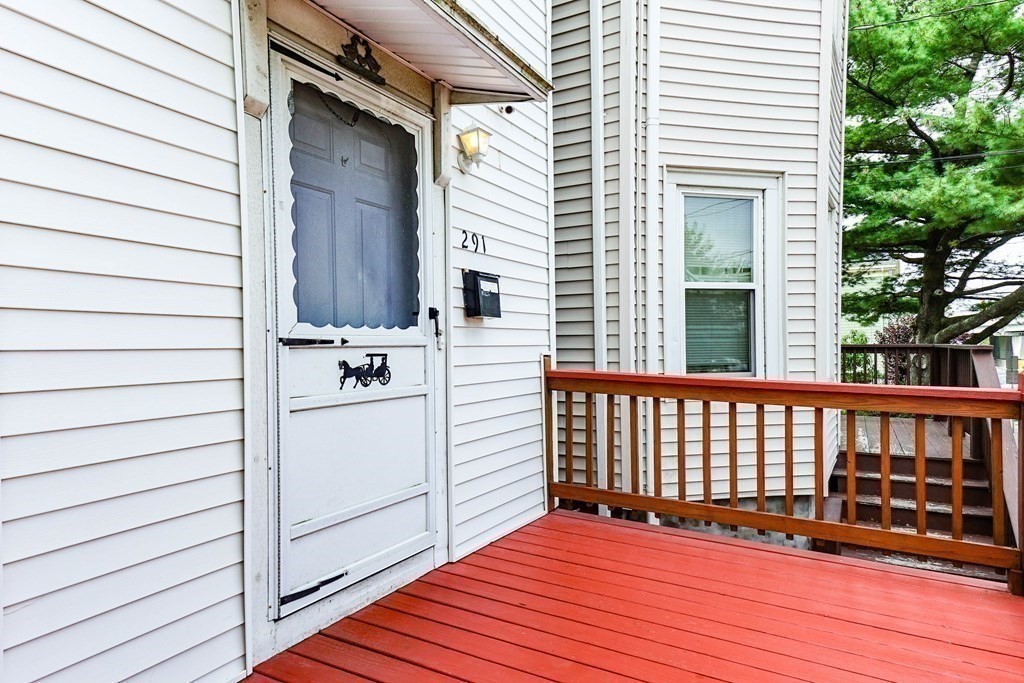 291 Carter Street Chelsea, MA 02150 - Photo 4 of 40 a view of a balcony with wooden floor