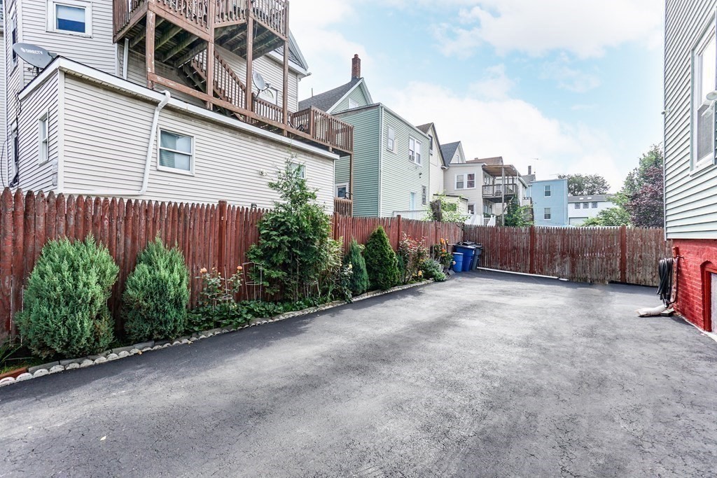 291 Carter Street Chelsea, MA 02150 - Photo 7 of 40 a view of a house with backyard and garden