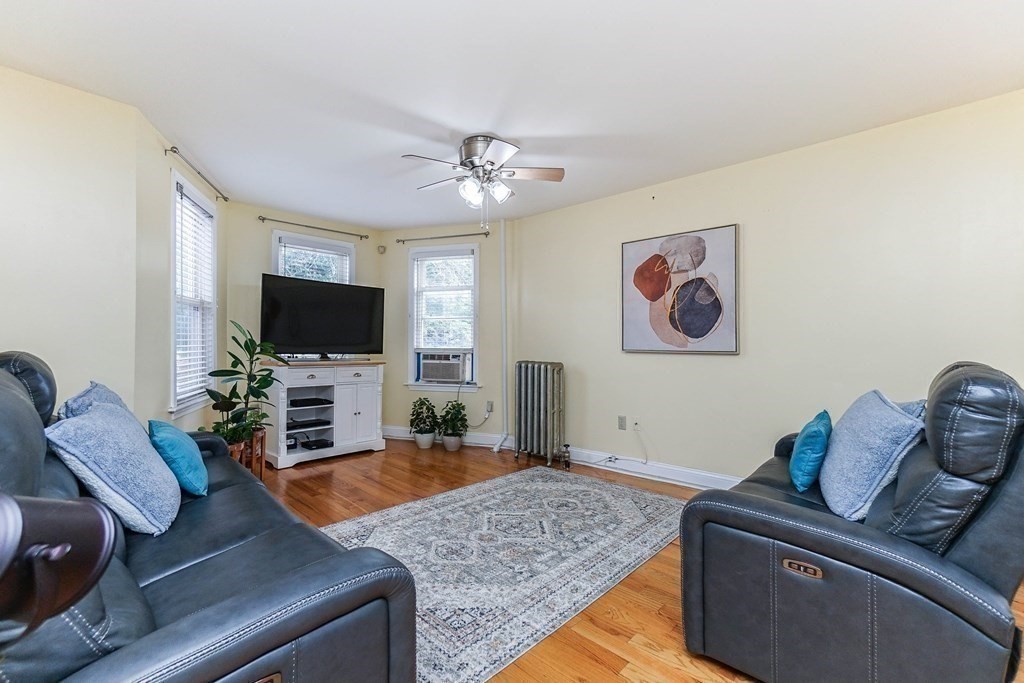 291 Carter Street Chelsea, MA 02150 - Photo 10 of 40 a living room with furniture and a flat screen tv