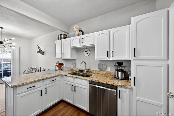 a kitchen with stainless steel appliances a stove a microwave and a refrigerator