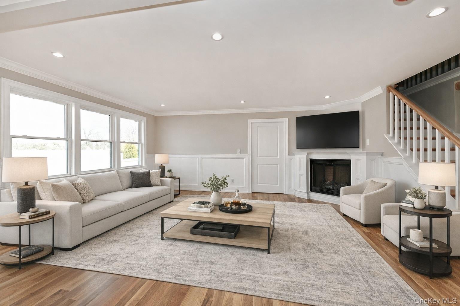 1903 George Court Merrick, NY 11566 - Photo 14 of 39 a living room with furniture a fireplace and a table