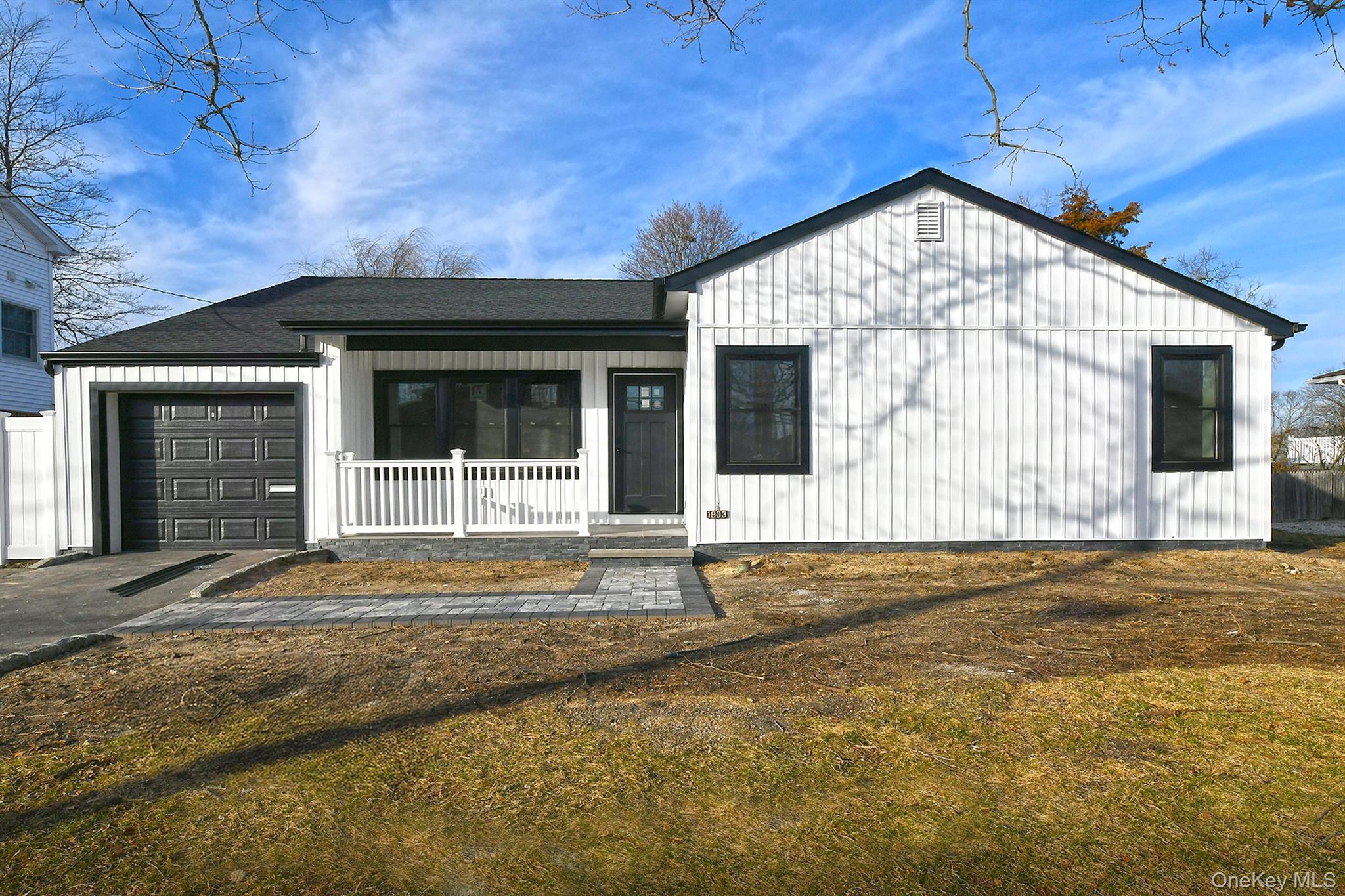 1903 George Court Merrick, NY 11566 - Photo 4 of 39 a front view of a house with a yard