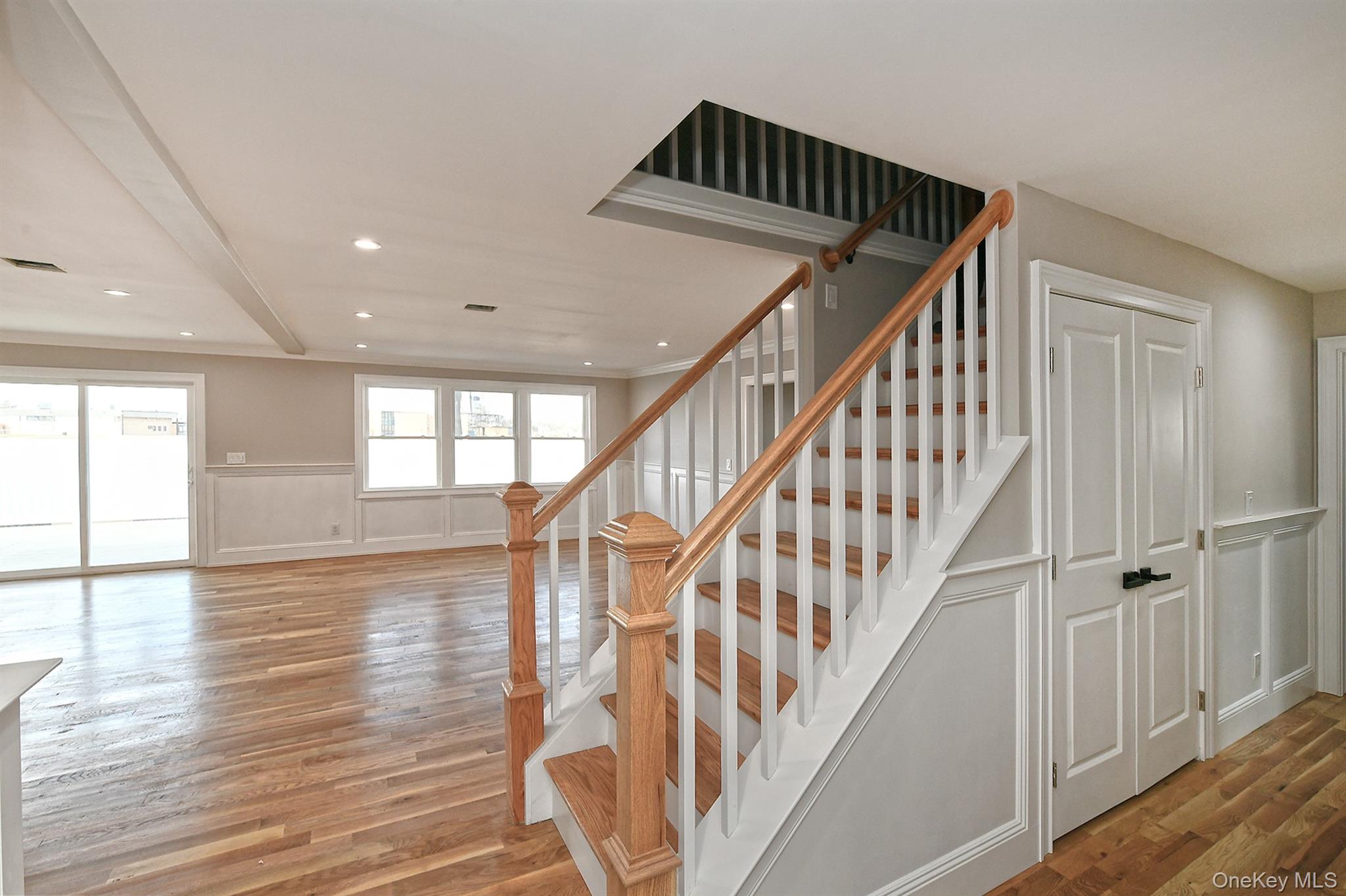 1903 George Court Merrick, NY 11566 - Photo 7 of 39 a view of entryway and hall with wooden floor
