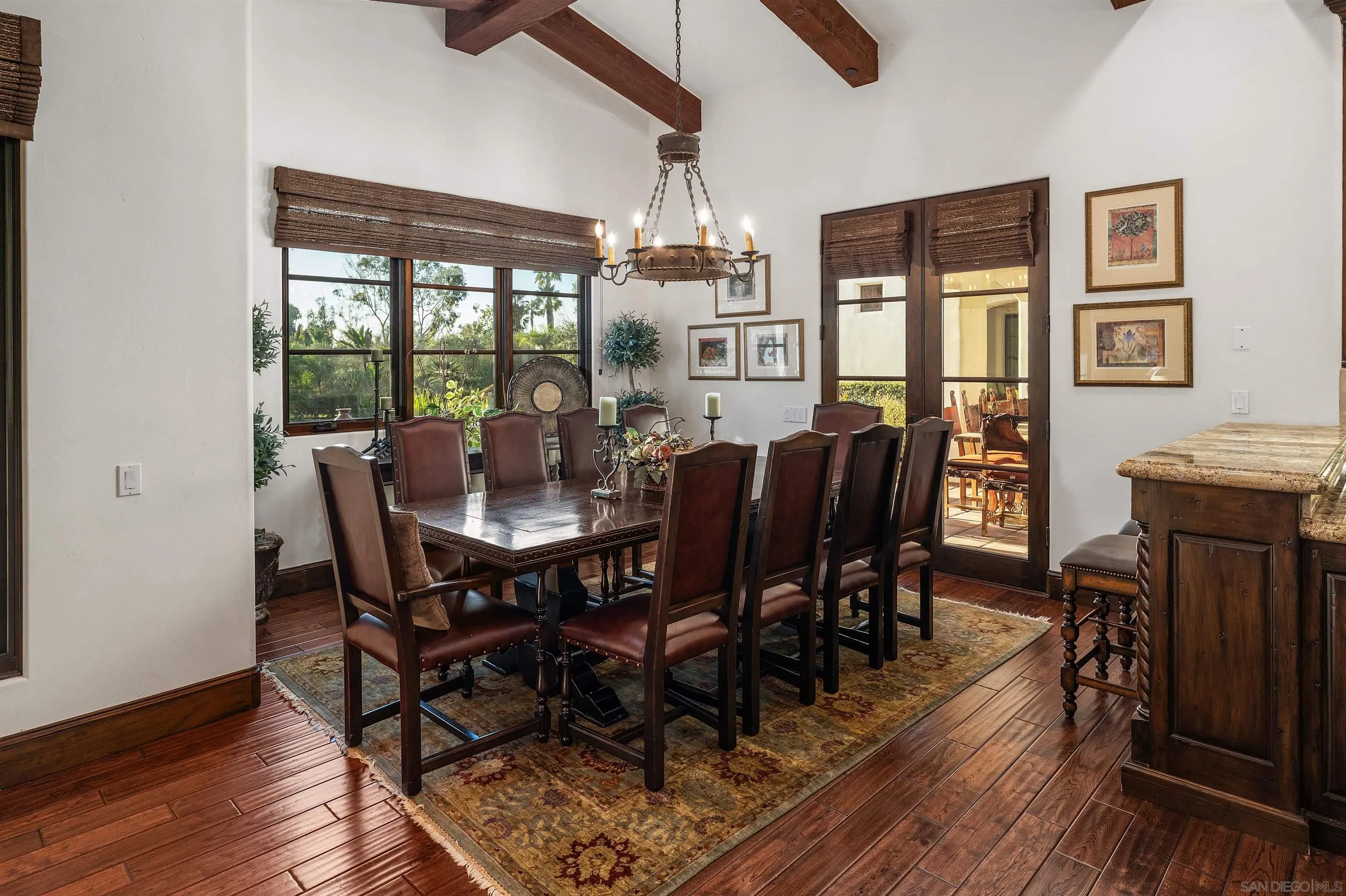 6870 La Valle Plateada Rancho Santa Fe, CA 92067 - Photo 15 of 37 a view of a dining room with furniture window and wooden floor