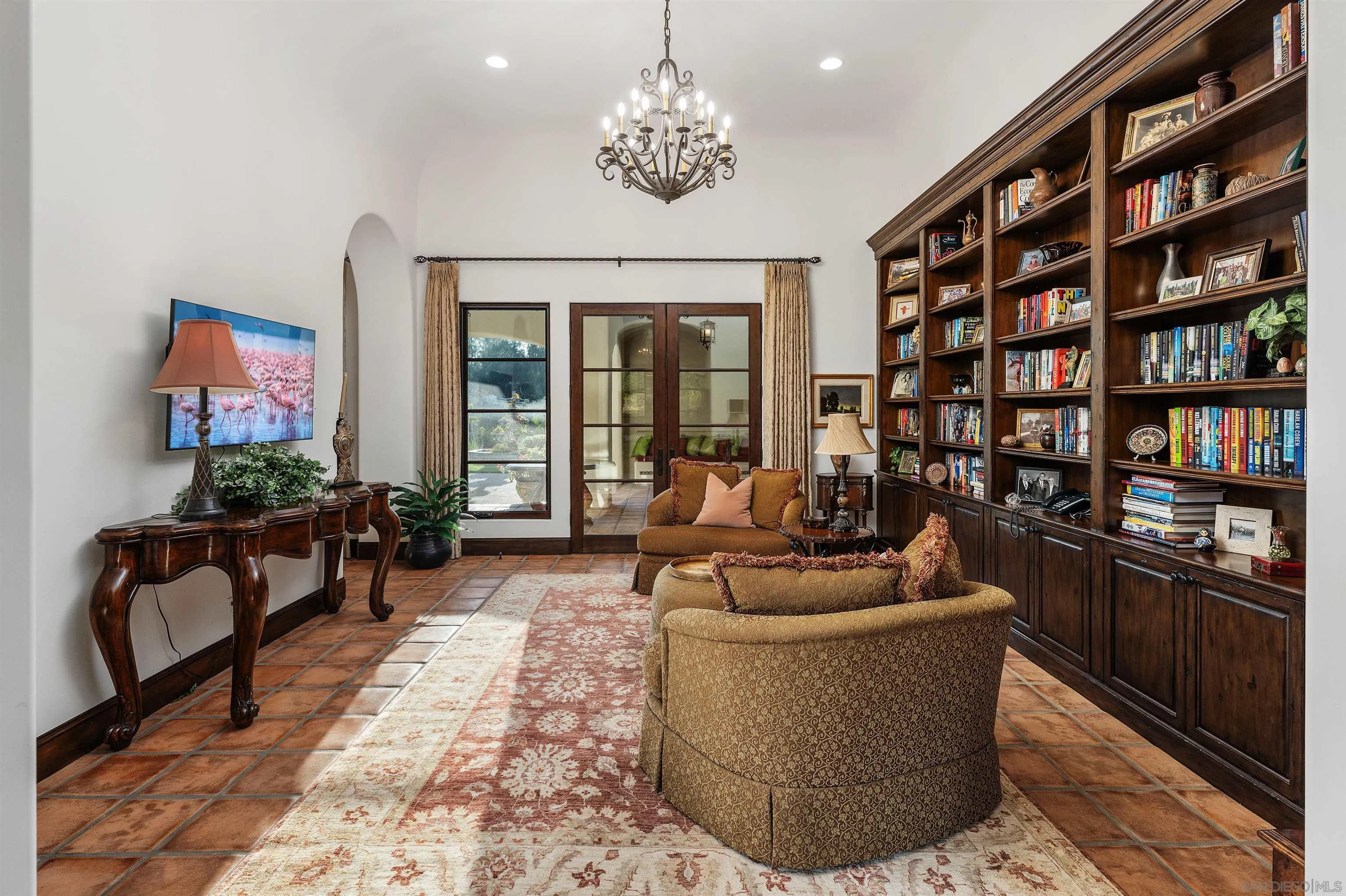 6870 La Valle Plateada Rancho Santa Fe, CA 92067 - Photo 18 of 37 a living room with fireplace furniture and a flat screen tv