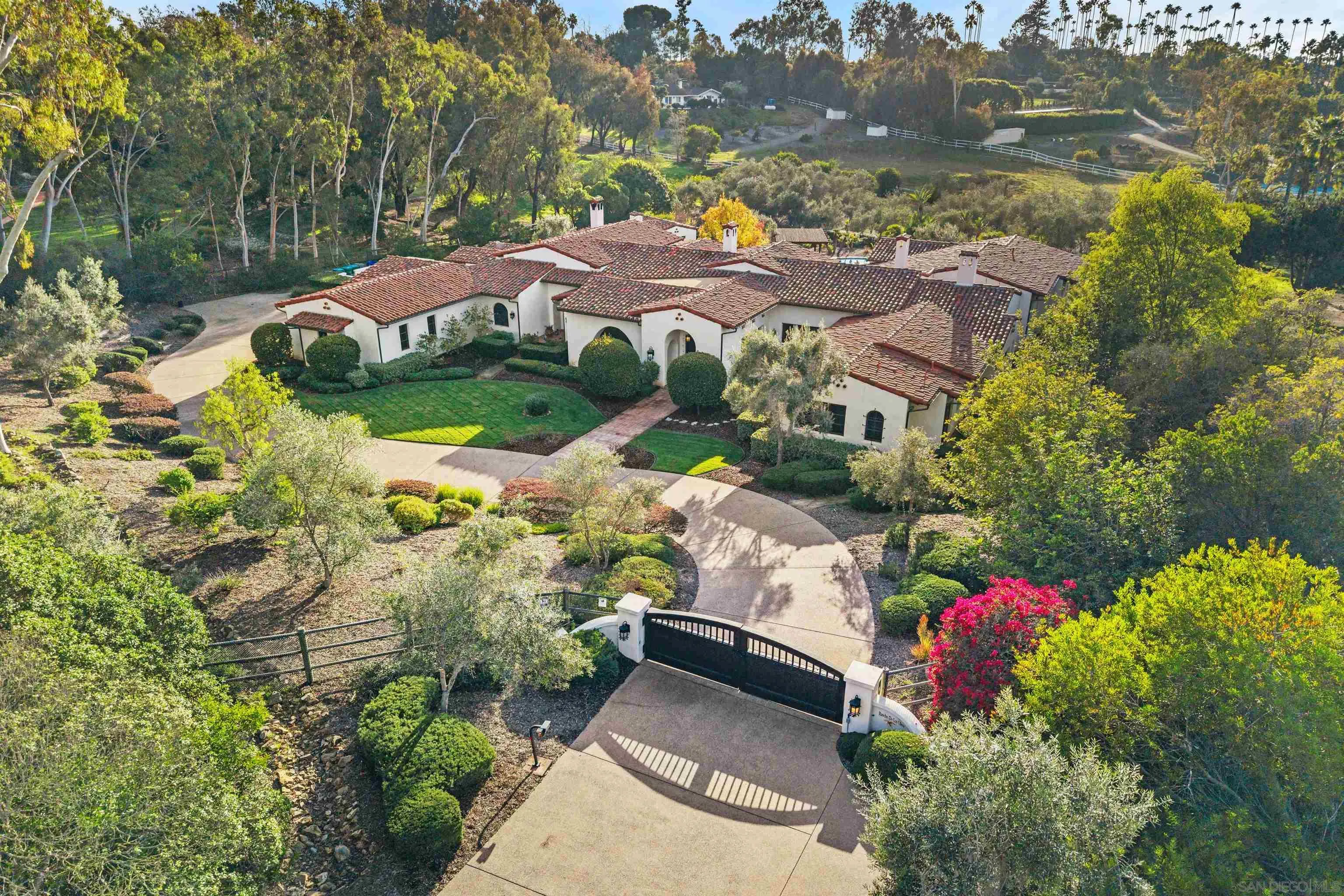 6870 La Valle Plateada Rancho Santa Fe, CA 92067 - Photo 2 of 37 a view of a street with houses