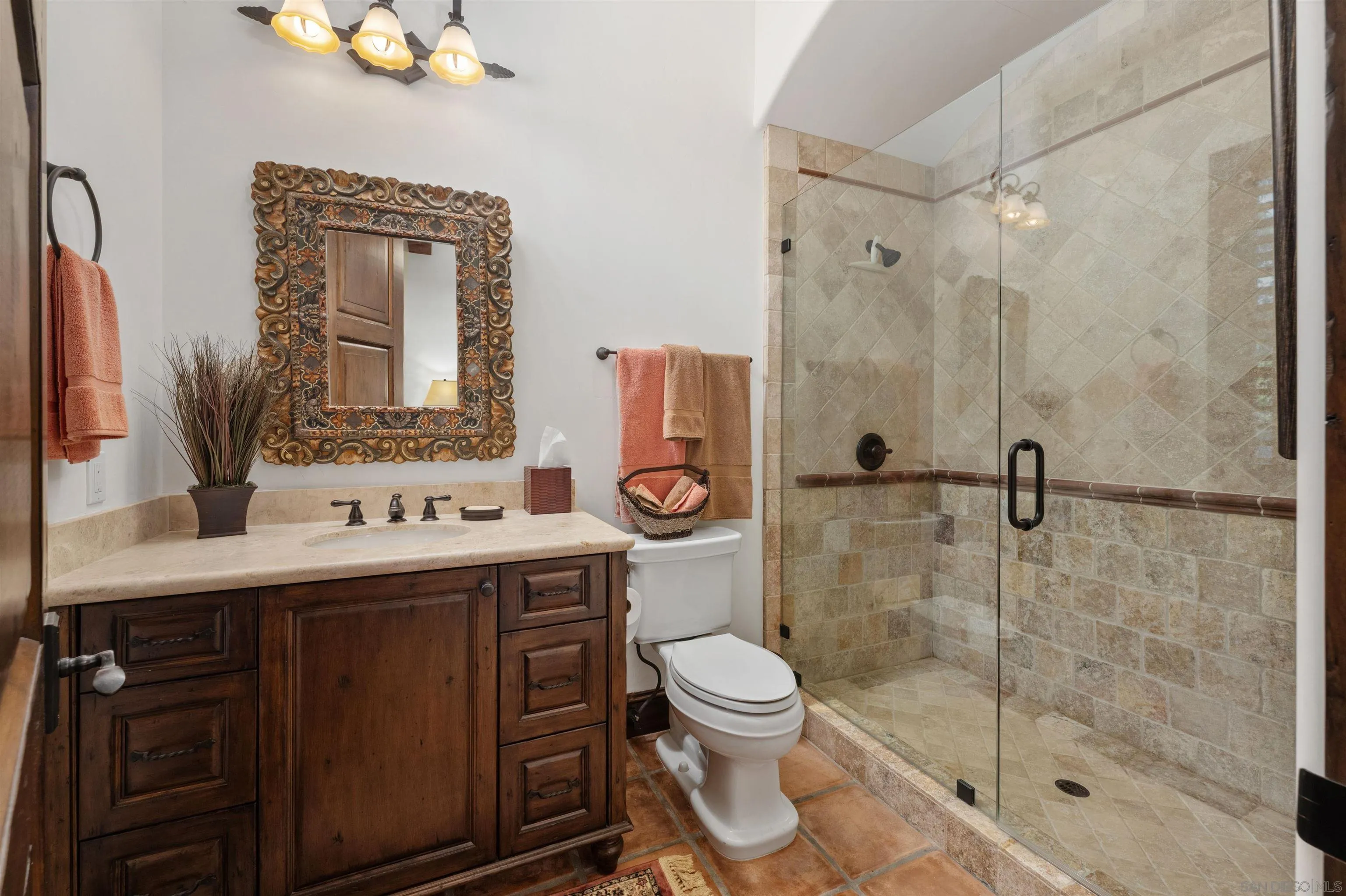 6870 La Valle Plateada Rancho Santa Fe, CA 92067 - Photo 21 of 37 a bathroom with a toilet a sink and shower