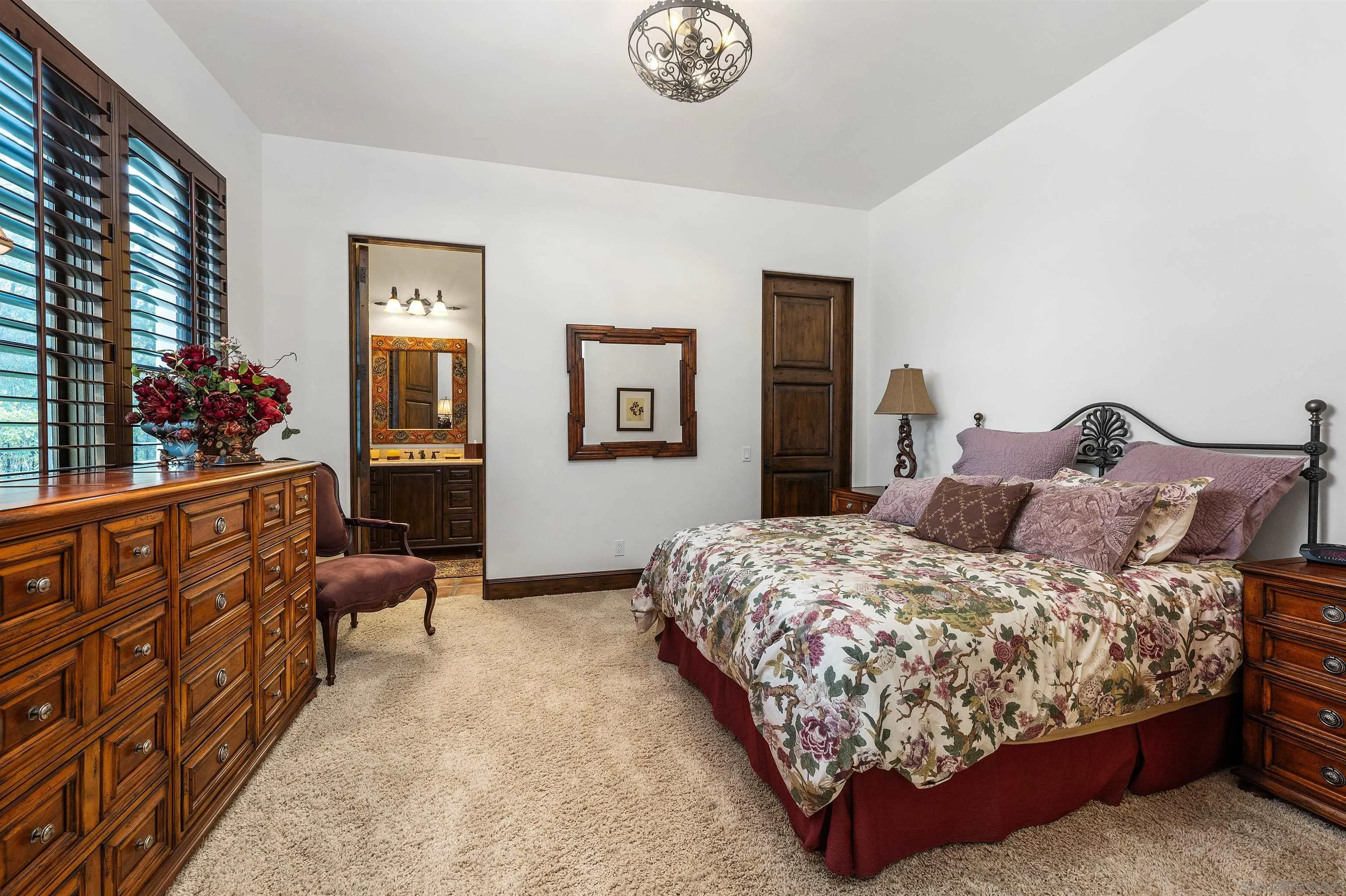 6870 La Valle Plateada Rancho Santa Fe, CA 92067 - Photo 22 of 37 a bedroom with a bed a couch and dresser