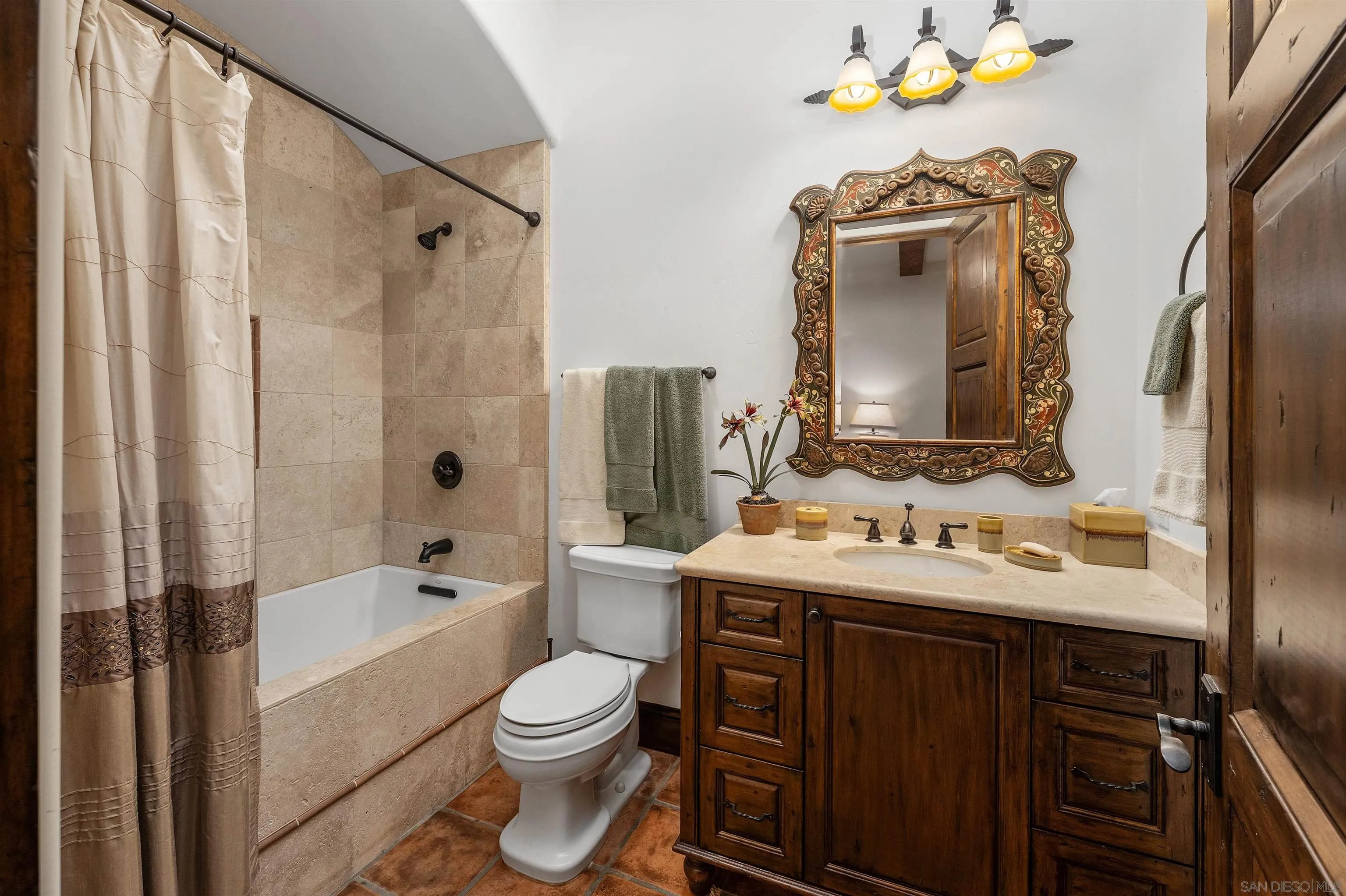 6870 La Valle Plateada Rancho Santa Fe, CA 92067 - Photo 23 of 37 a bathroom with a sink toilet a tub and shower