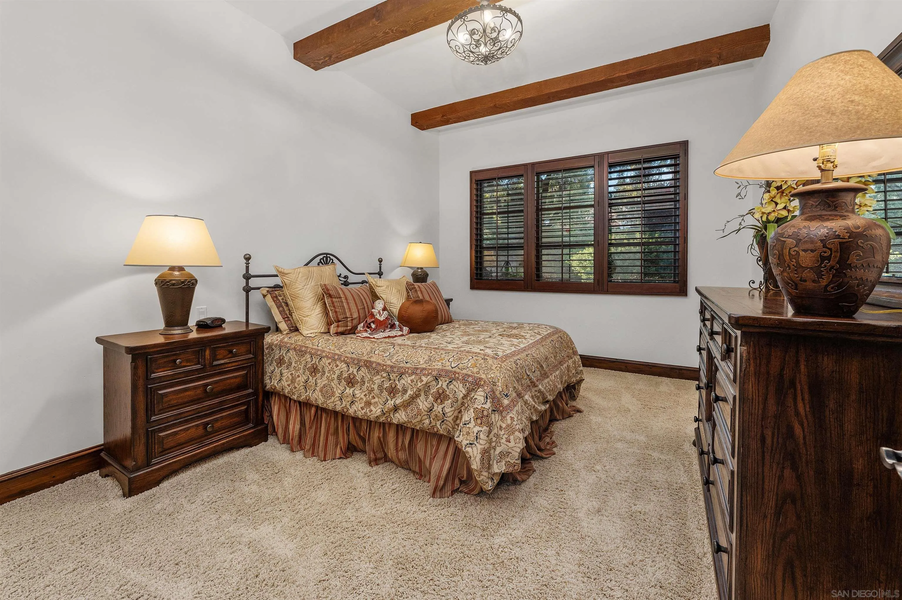 6870 La Valle Plateada Rancho Santa Fe, CA 92067 - Photo 24 of 37 a bedroom with a bed and a window
