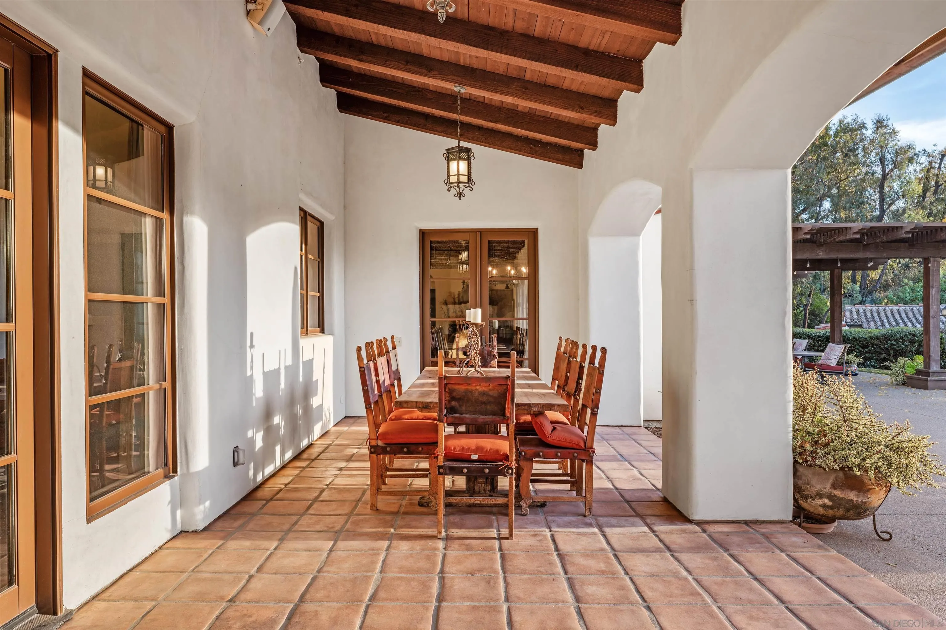 6870 La Valle Plateada Rancho Santa Fe, CA 92067 - Photo 26 of 37 a dining room with furniture and wooden floor