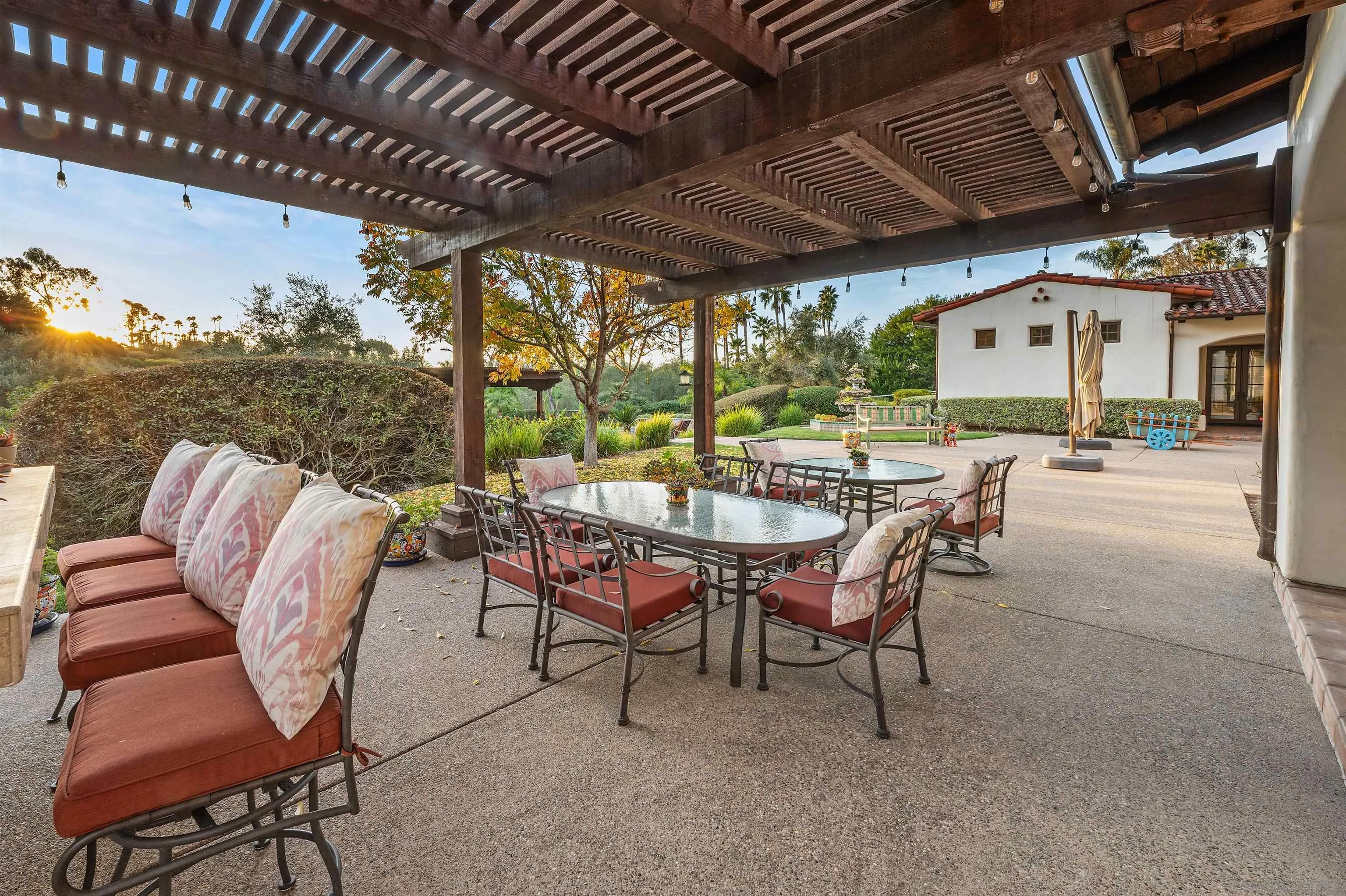6870 La Valle Plateada Rancho Santa Fe, CA 92067 - Photo 27 of 37 a dining room with furniture and a floor to ceiling window