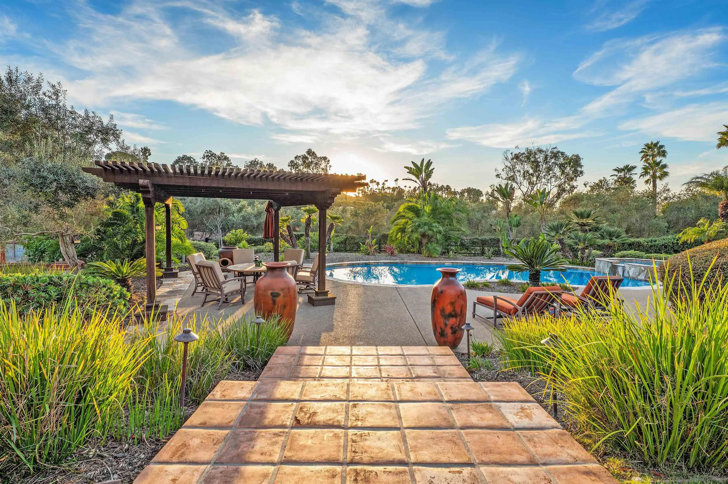 6870 La Valle Plateada Rancho Santa Fe, CA 92067 - Photo 28 of 37 a view of a swimming pool with a patio