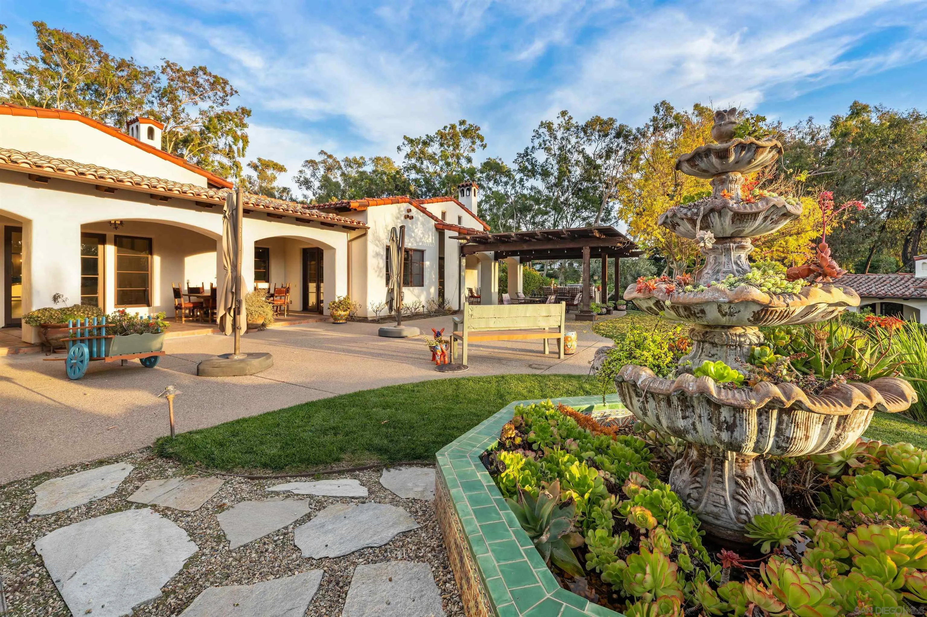6870 La Valle Plateada Rancho Santa Fe, CA 92067 - Photo 30 of 37 a front view of a house with a garden