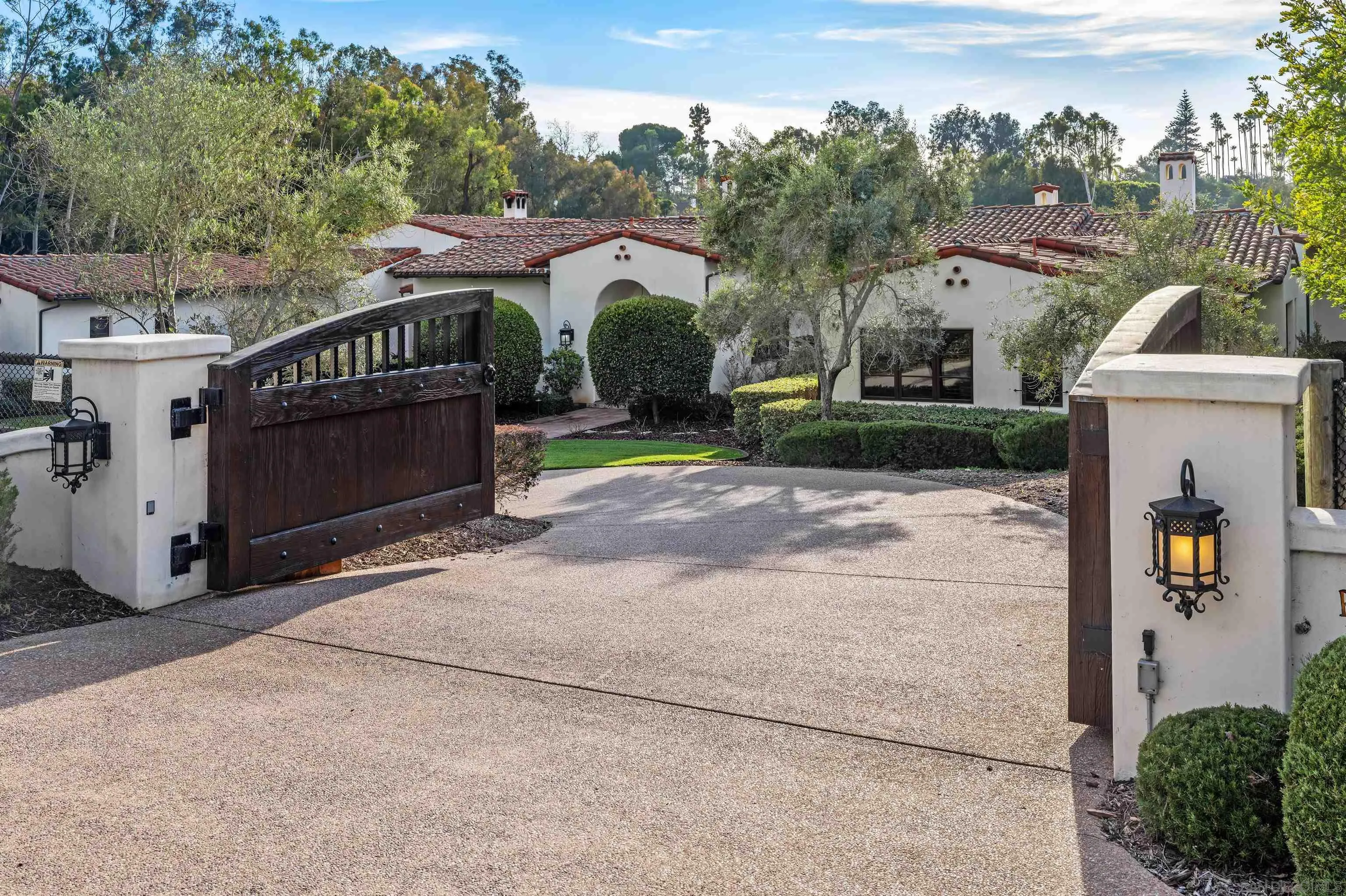 6870 La Valle Plateada Rancho Santa Fe, CA 92067 - Photo 34 of 37 a view of a house with a yard