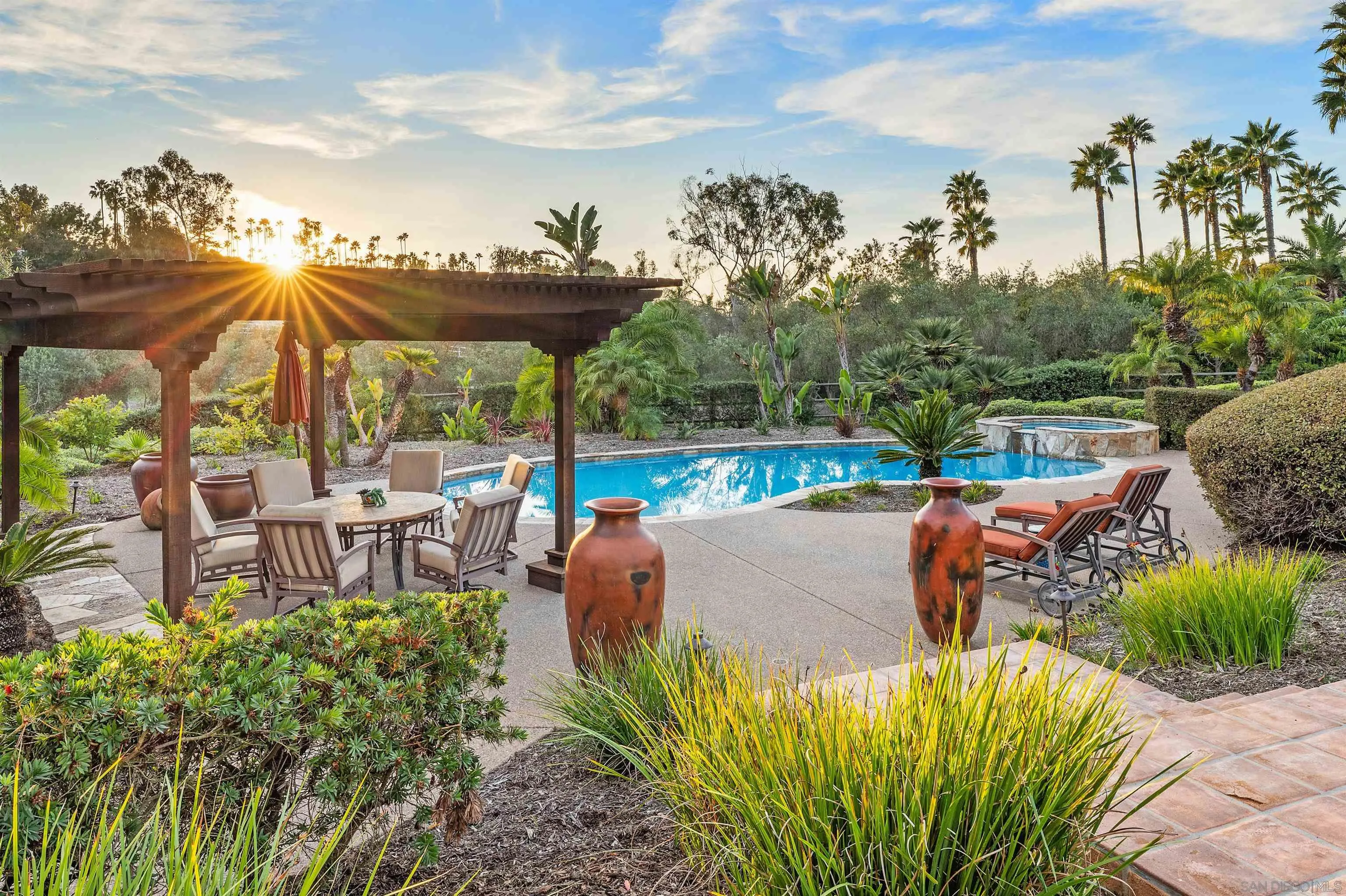 6870 La Valle Plateada Rancho Santa Fe, CA 92067 - Photo 5 of 37 a view of a patio with furniture and a garden