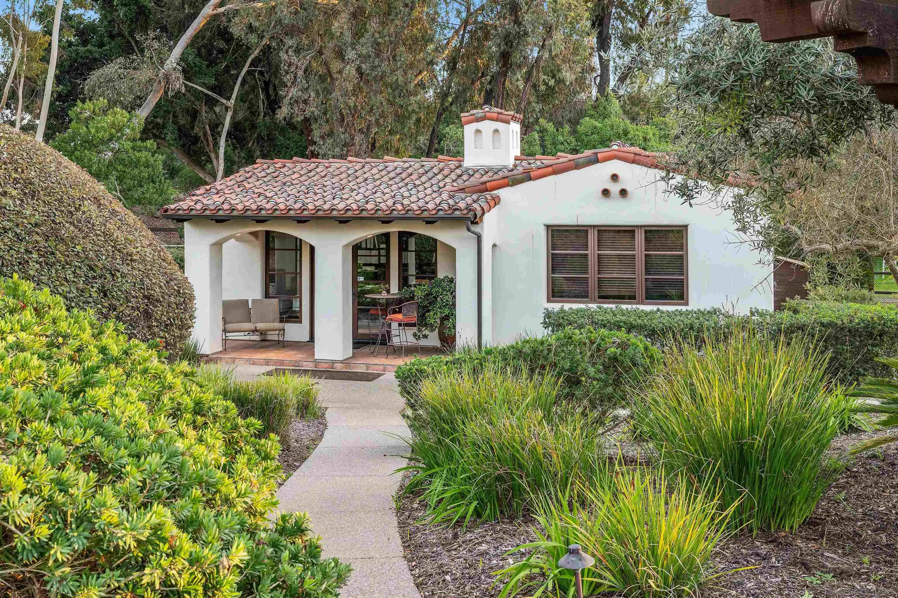 6870 La Valle Plateada Rancho Santa Fe, CA 92067 - Photo 6 of 37 a front view of a house with garden