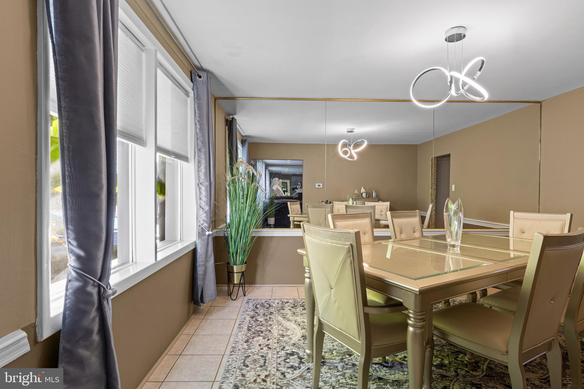 2606 Springfield Road Broomall, PA 19008 - Photo 11 of 32 a view of a dining room with furniture and a chandelier
