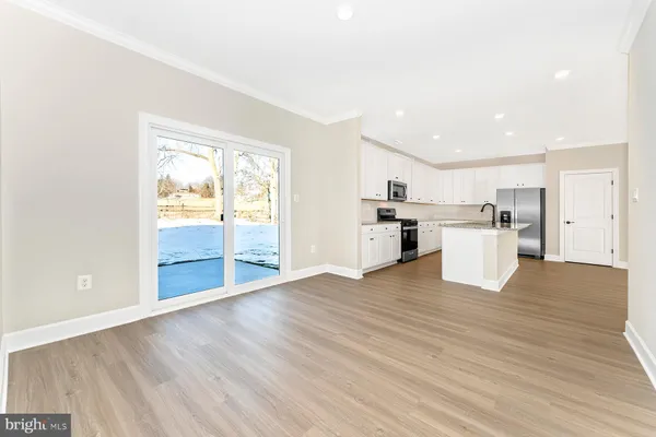 a view of kitchen with wooden floor