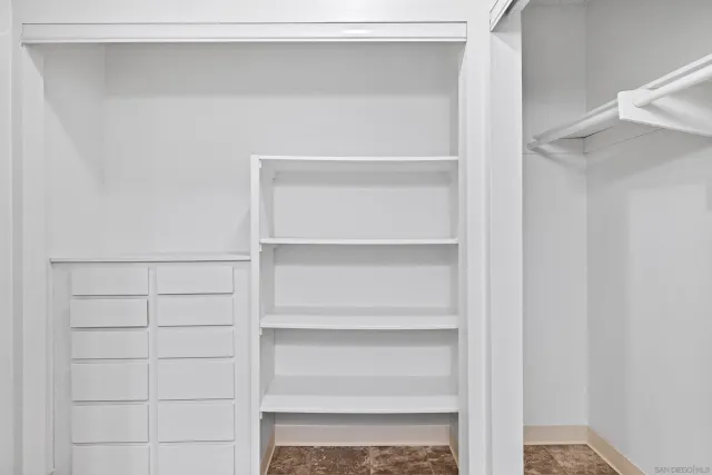 a view of a house with pool and chairs
