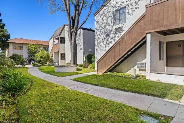 a view of a pathway along the building
