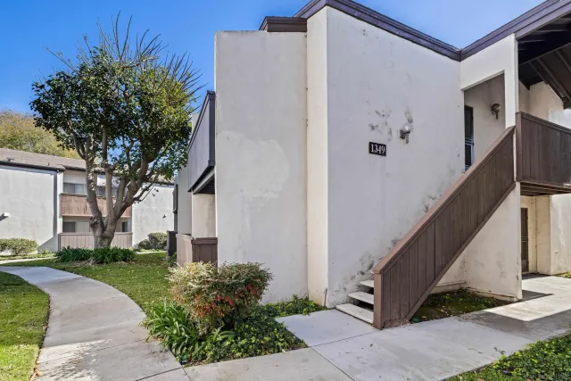a view of a hallway with entryway door