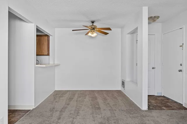 a kitchen with stainless steel appliances a refrigerator sink and microwave