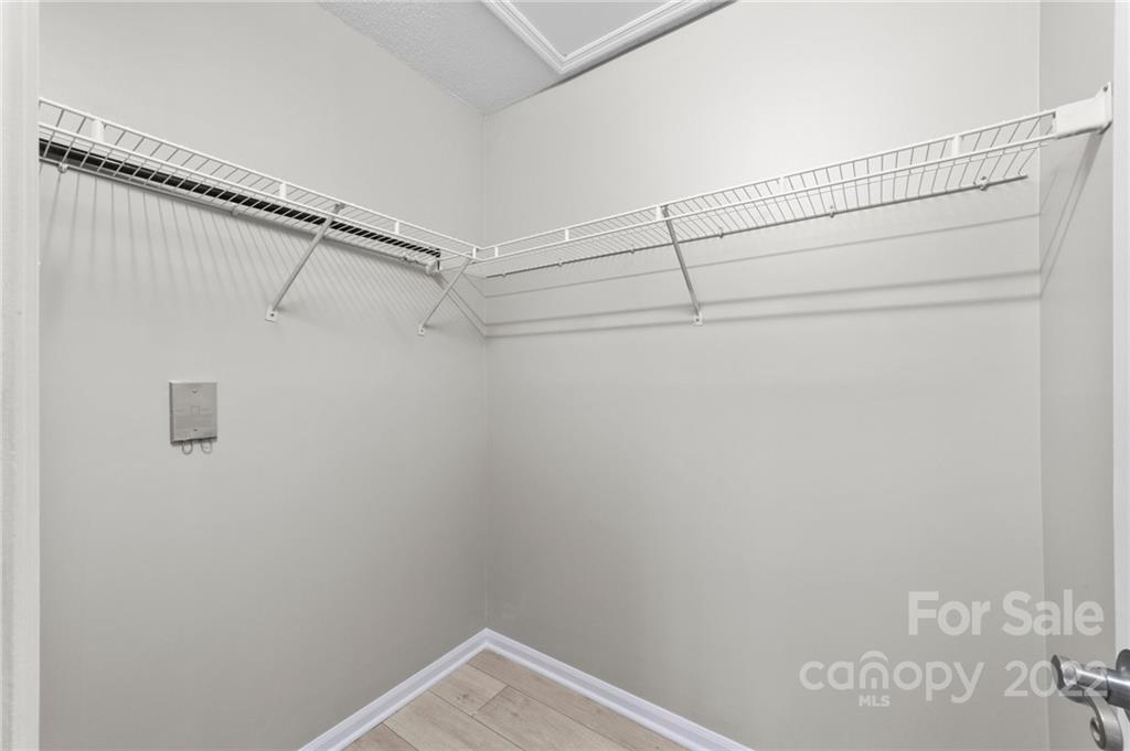 20105 Henderson Road, Unit E Cornelius, NC 28031 - Photo 15 of 23 a view of a room with racks on the wall