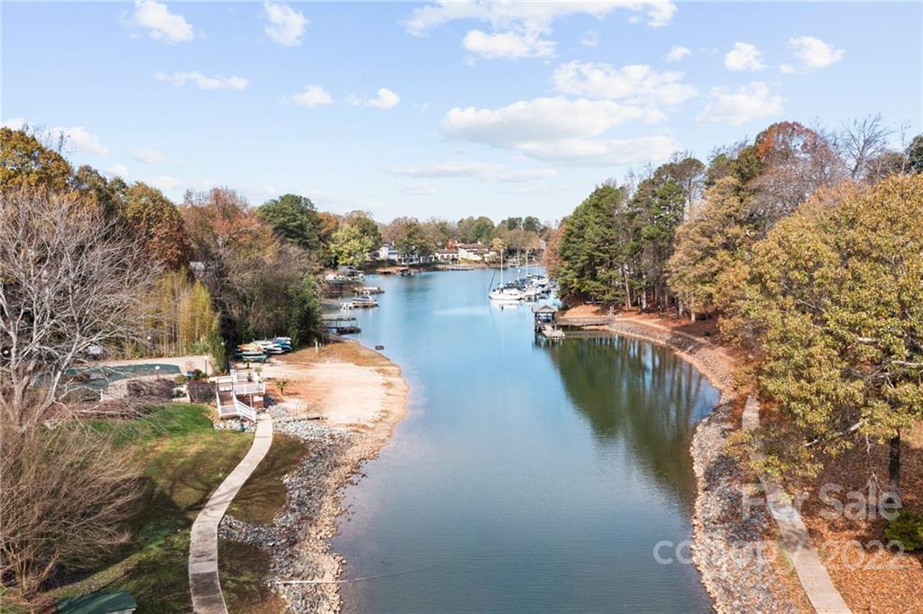 20105 Henderson Road, Unit E Cornelius, NC 28031 - Photo 3 of 23 a view of a lake with outdoor space