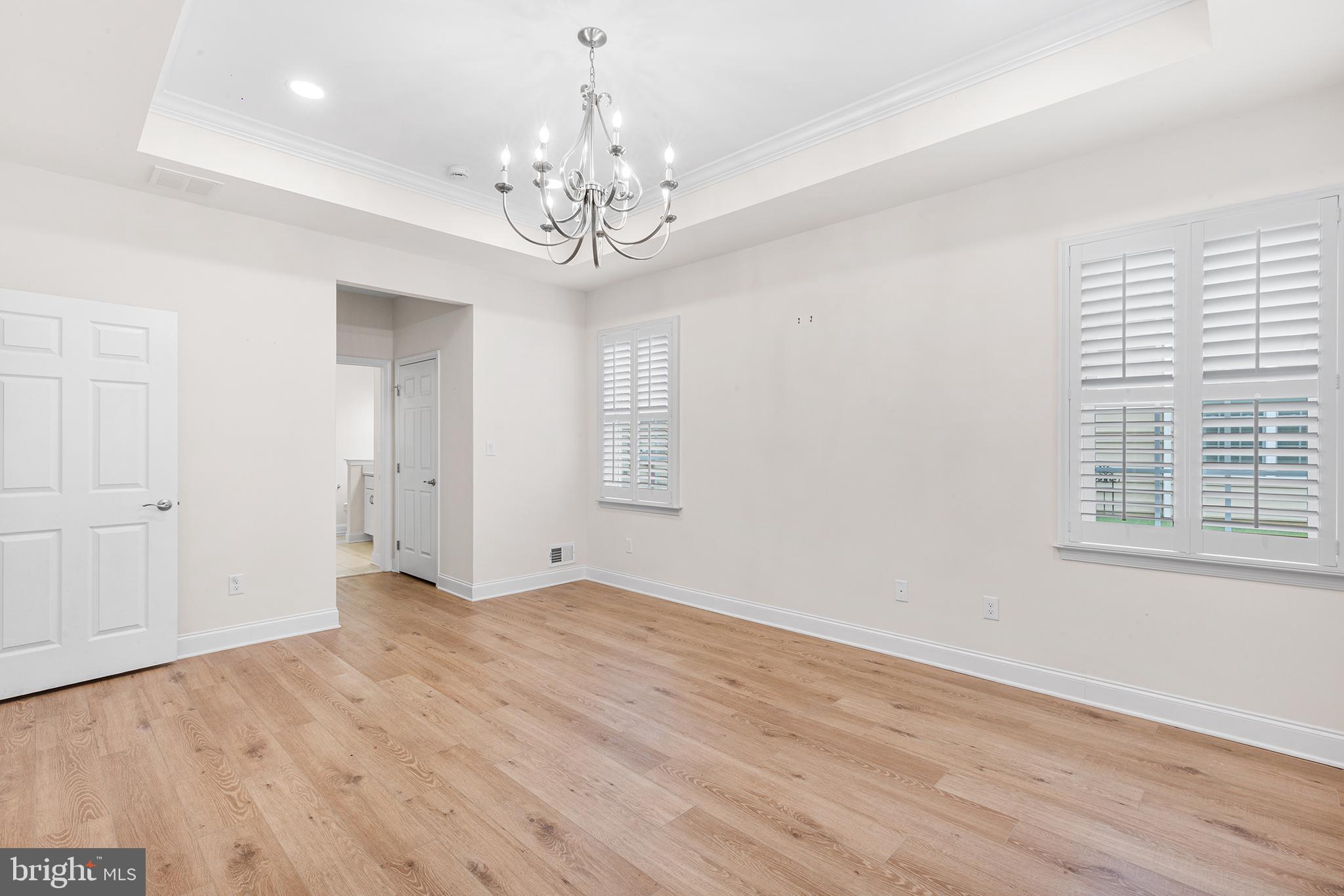 116 American Way Downingtown, PA 19335 - Photo 19 of 41 a view of an empty room with wooden floor and a window