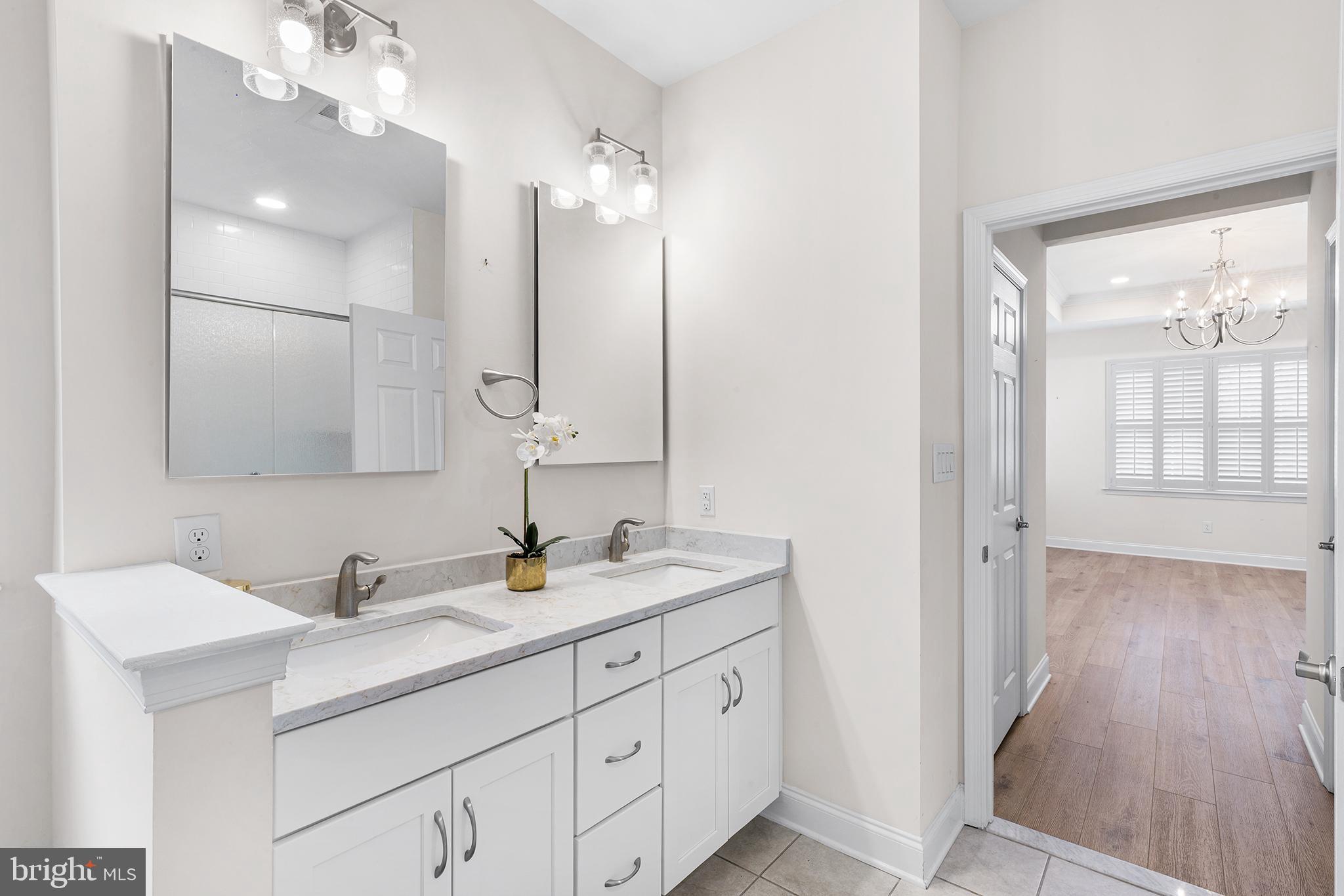 116 American Way Downingtown, PA 19335 - Photo 20 of 41 a bathroom with a double vanity sink and mirror with shower