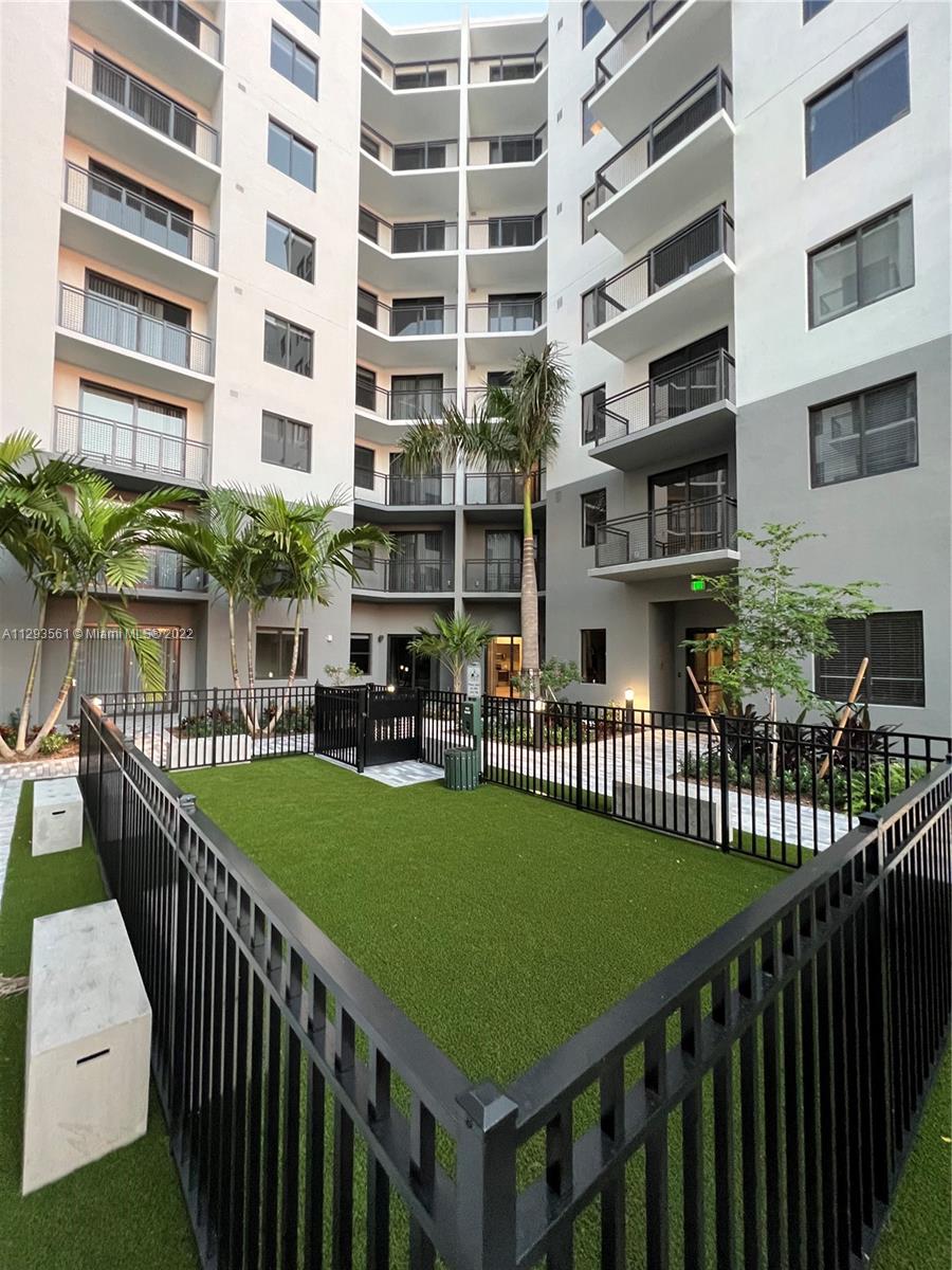 401 Hialeah Drive, Unit 320 Hialeah, FL 33010 - Photo 14 of 27 a view of a building with garden