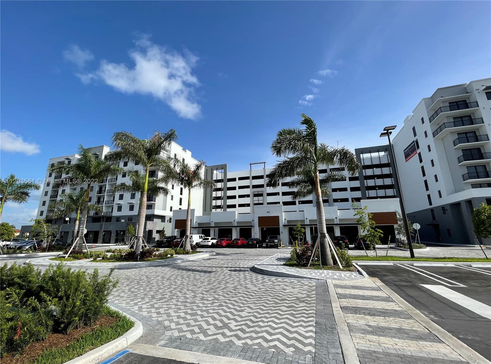 401 Hialeah Drive, Unit 320 Hialeah, FL 33010 - Photo 2 of 27 a building view with outdoor space