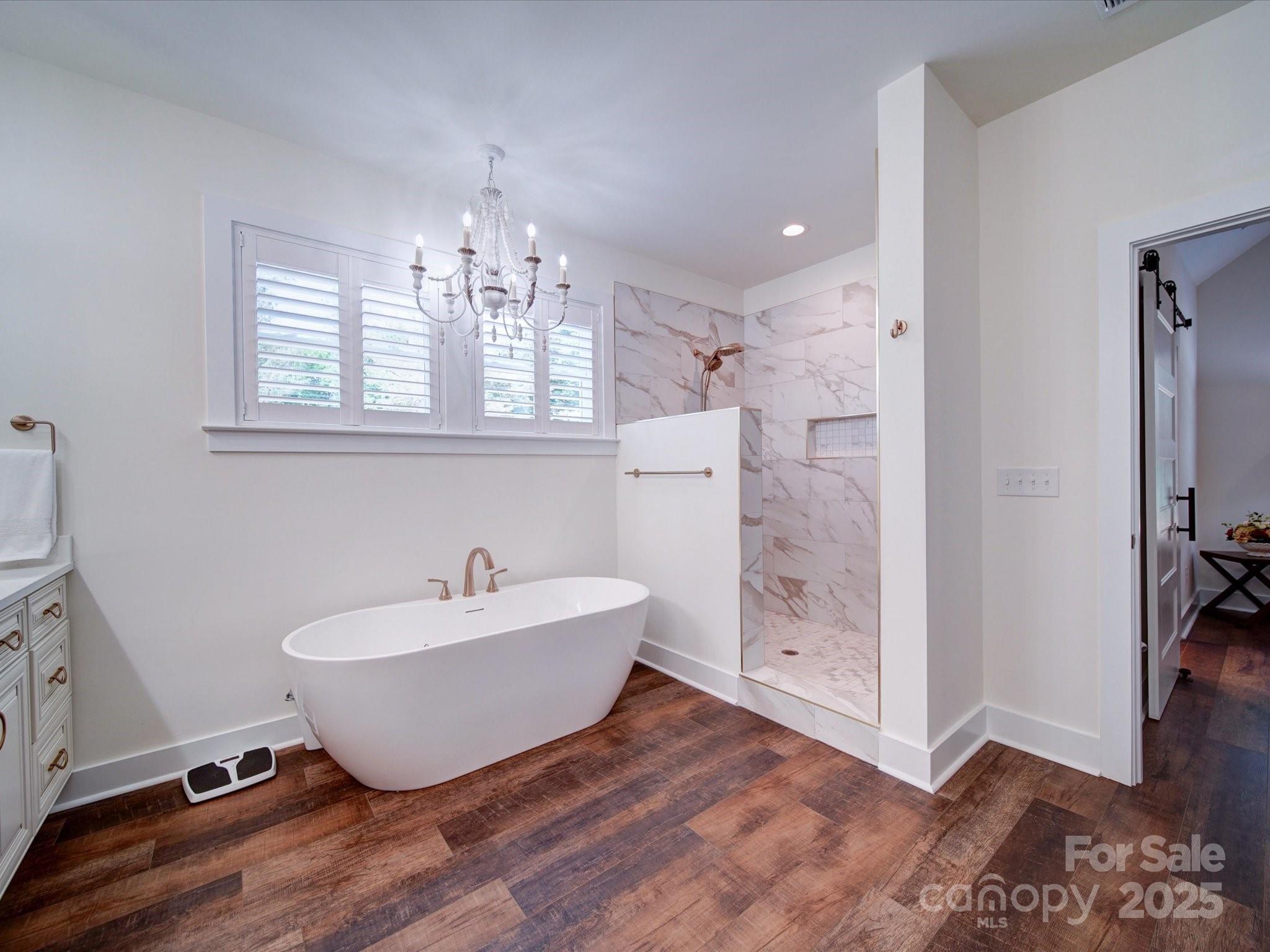 0 Trull Hinson Road, Unit 2 Wingate, NC 28174 - Photo 12 of 25 a spacious bathroom with a bathtub and a shower
