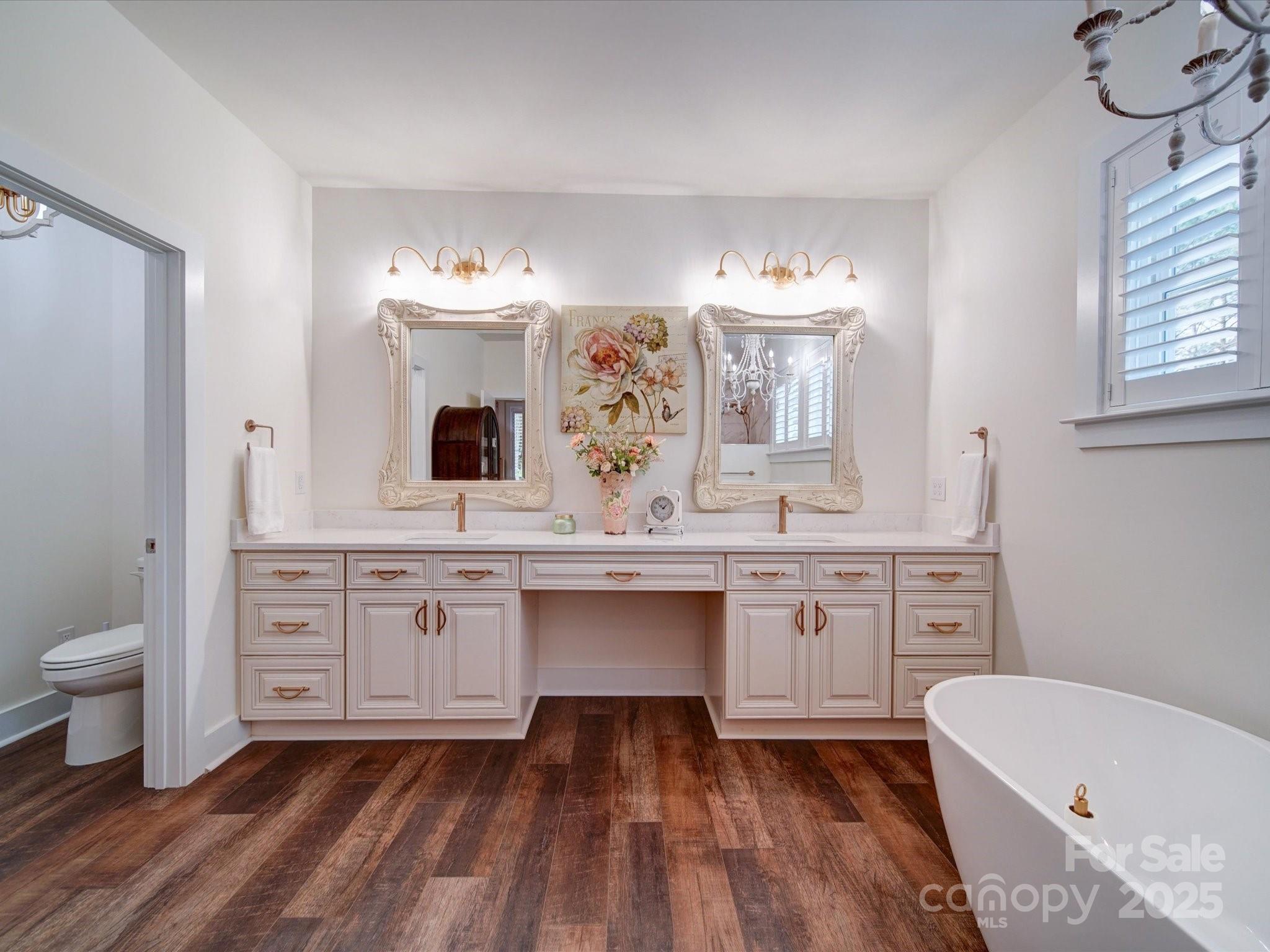 0 Trull Hinson Road, Unit 2 Wingate, NC 28174 - Photo 4 of 25 a spacious bathroom with a granite countertop sink mirror and toilet