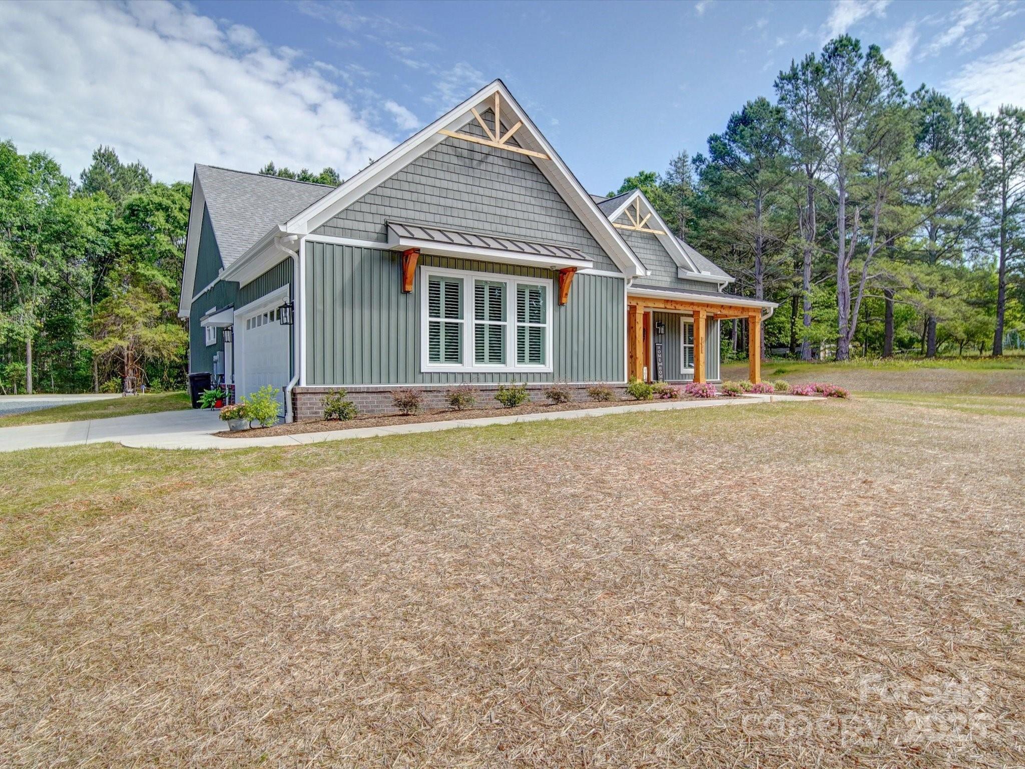0 Trull Hinson Road, Unit 2 Wingate, NC 28174 - Photo 5 of 25 a front view of a house with a yard