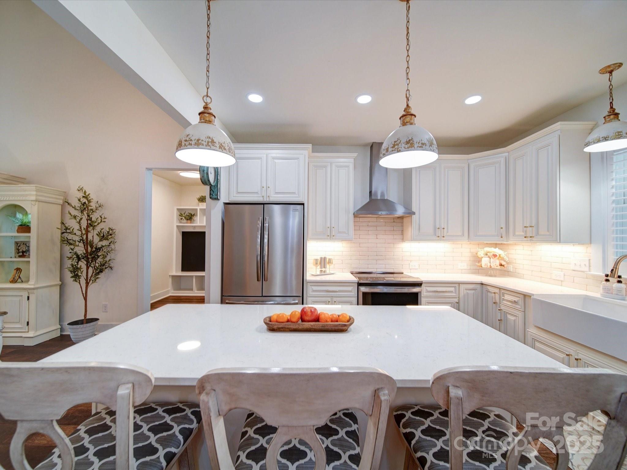0 Trull Hinson Road, Unit 2 Wingate, NC 28174 - Photo 10 of 25 a kitchen with stainless steel appliances kitchen island granite countertop a sink a stove a refrigerator and cabinets