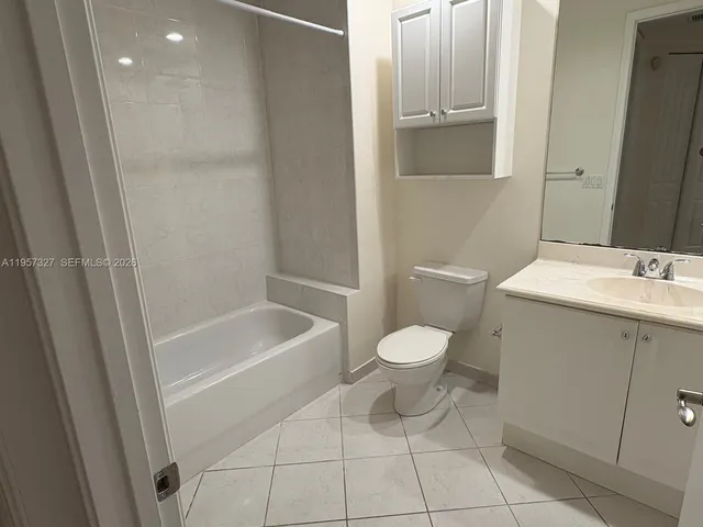 a bathroom with a glass door shower
