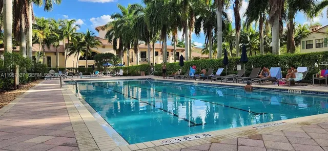 a view of a palm trees front of house