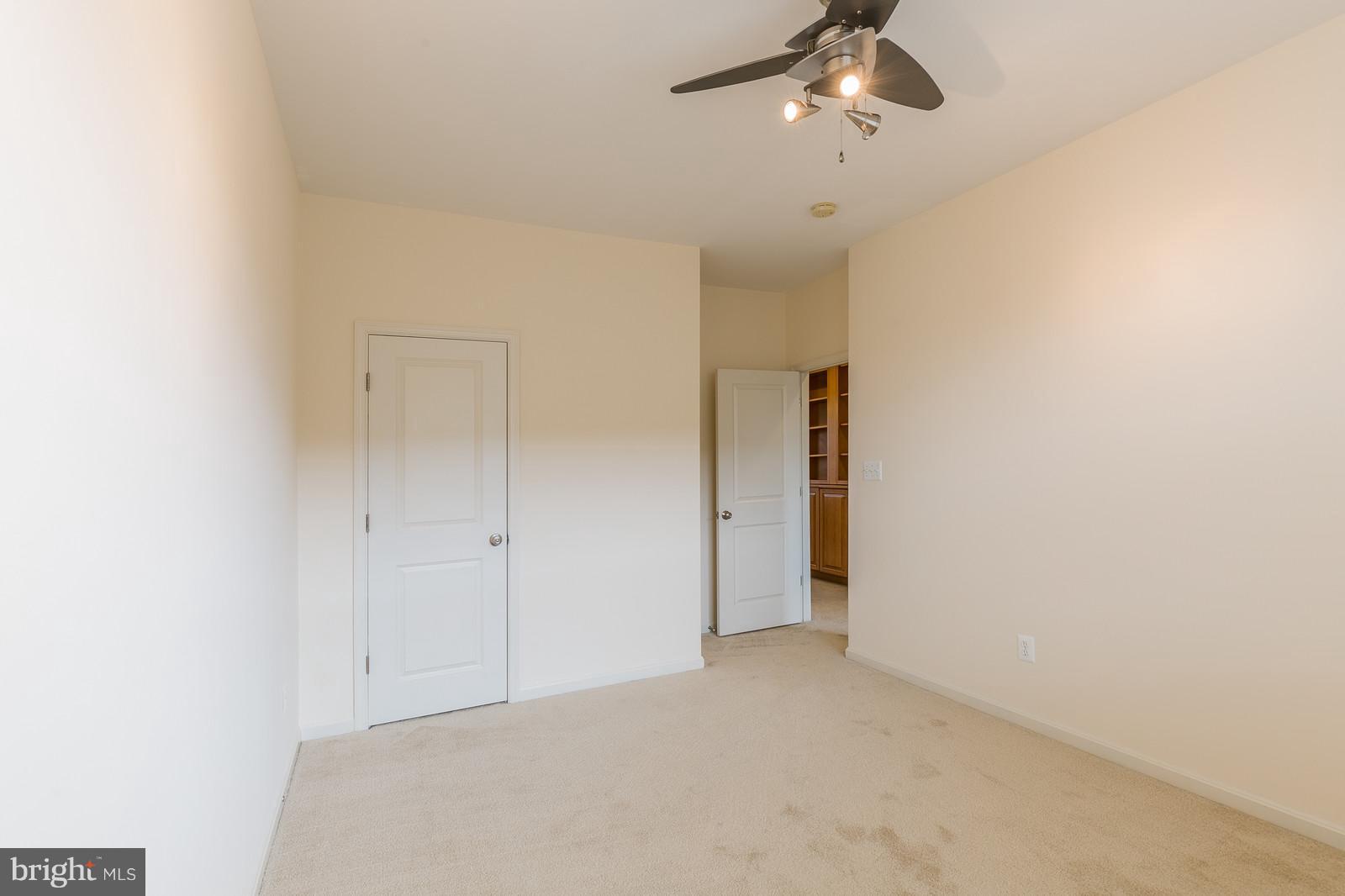 9104 Ribbon Falls Loop Bristow, VA 20136 - Photo 17 of 26 Second Bedroom with Closet & Ceiling Fan