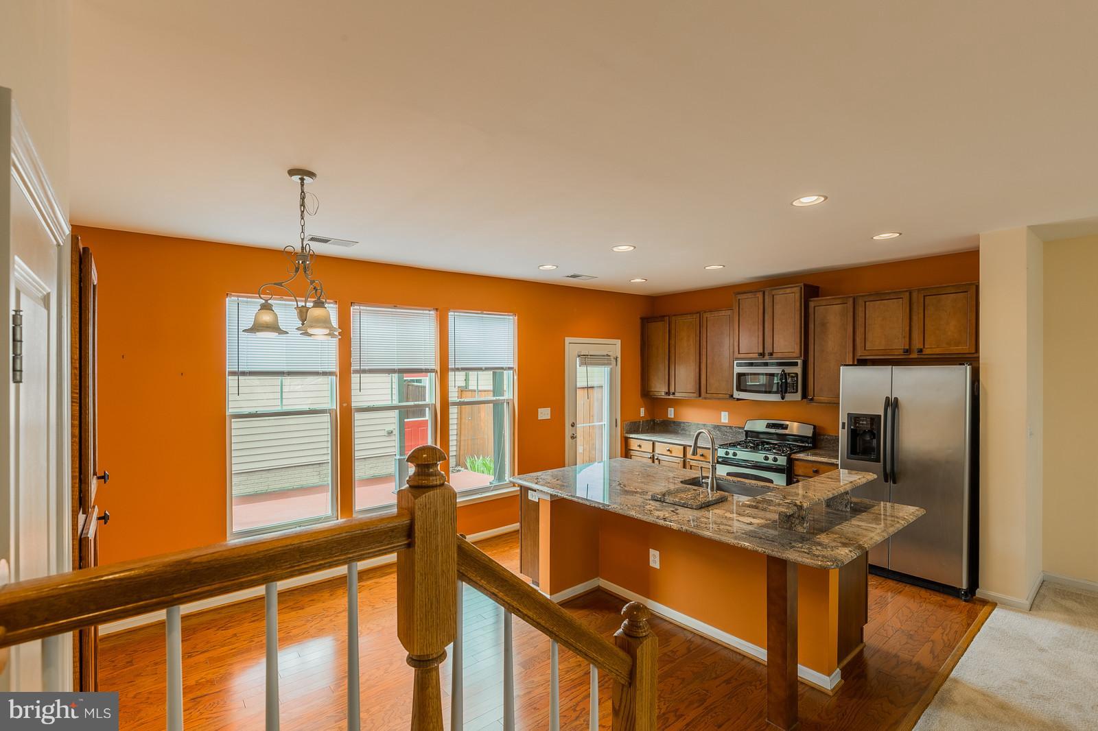 9104 Ribbon Falls Loop Bristow, VA 20136 - Photo 8 of 26 Sun Filled Kitchen