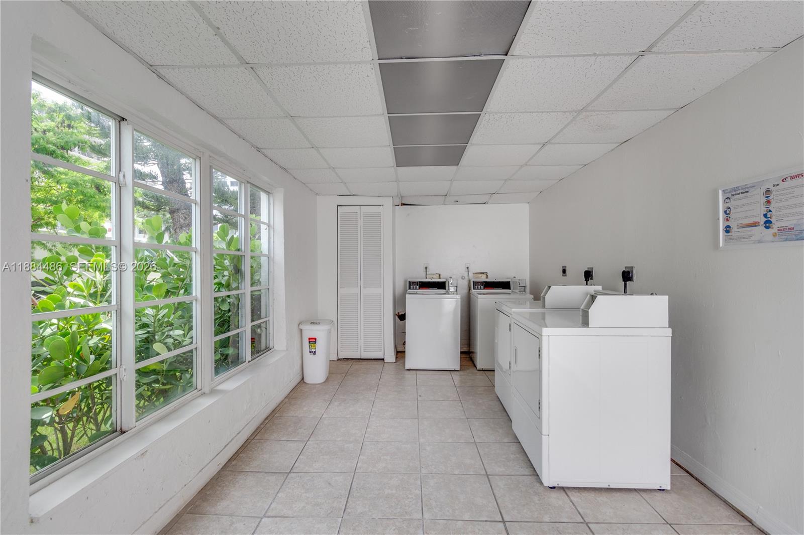 1241 14th Street, Unit 9 Miami Beach, FL 33139 - Photo 19 of 19 a large white room with a large window