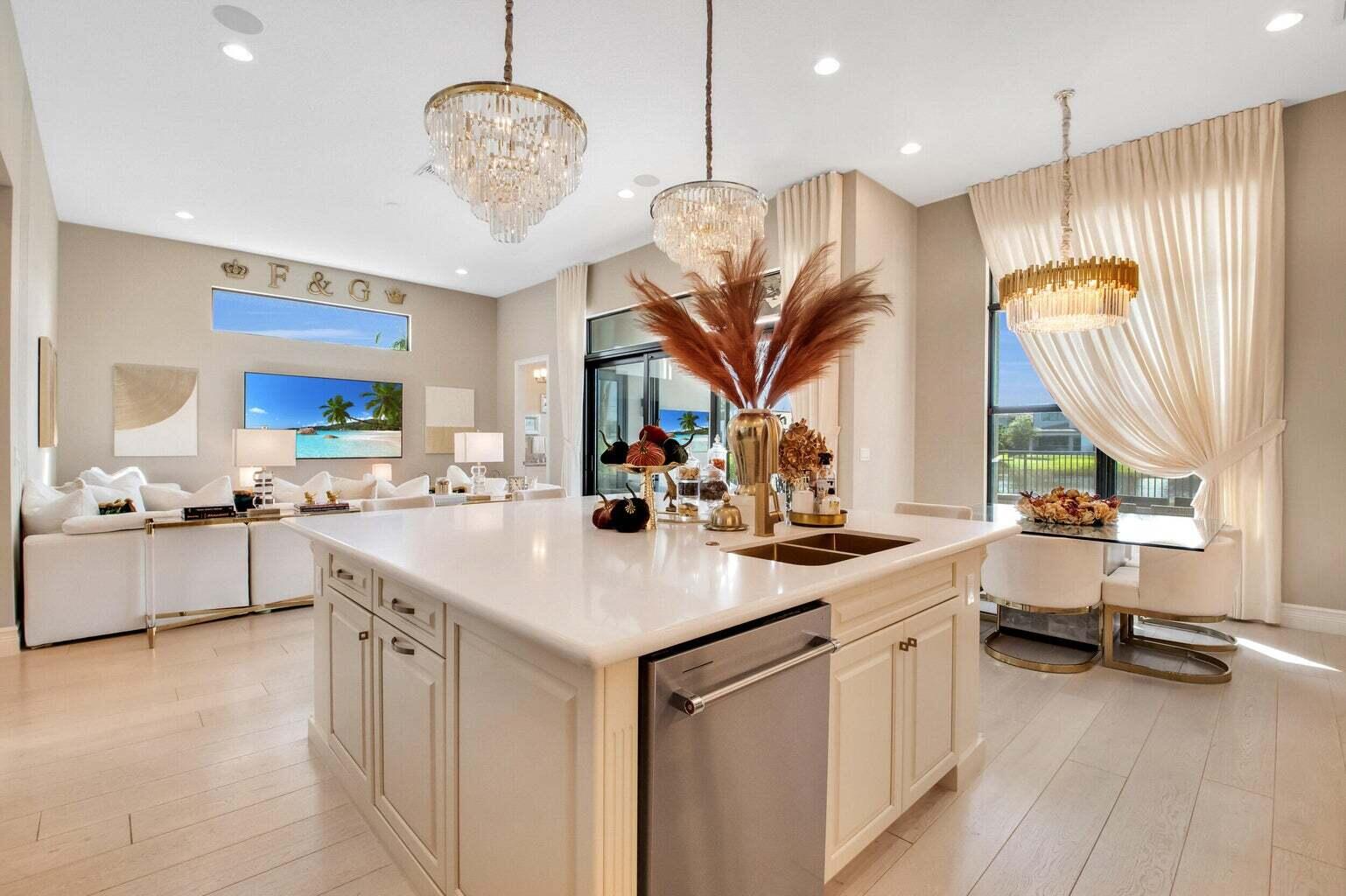 9016 Chauvet Way Boca Raton, FL 33496 - Photo 20 of 79 a kitchen with stainless steel appliances a sink a stove and a wooden floors