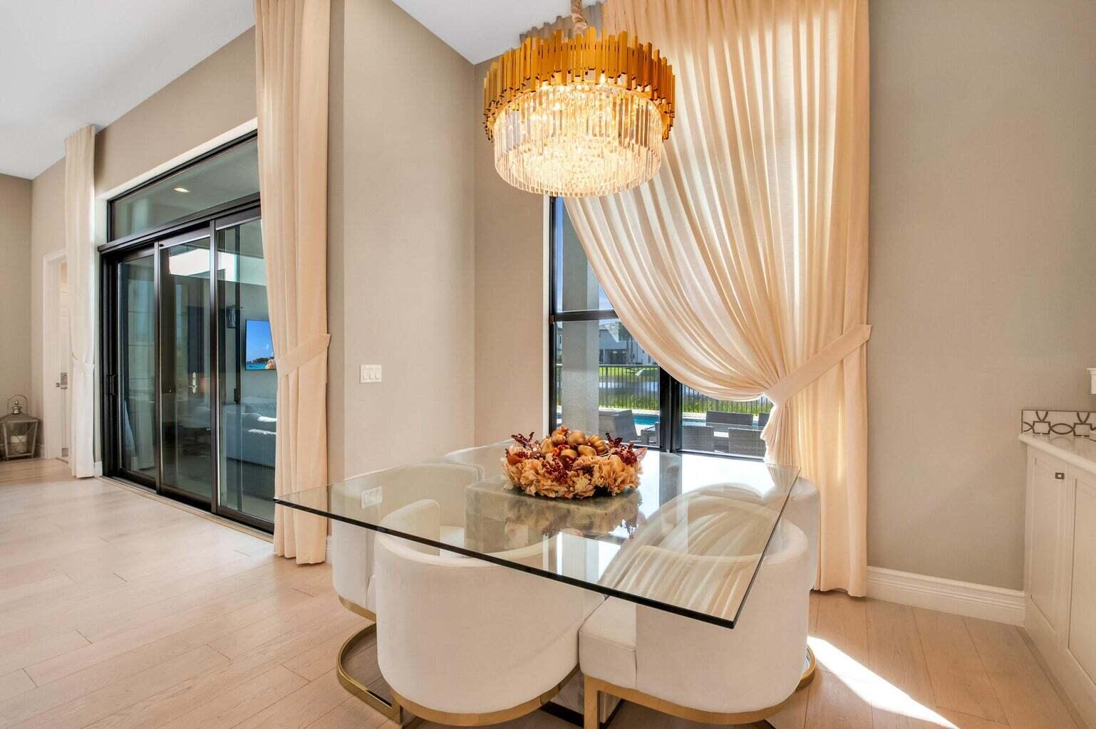 9016 Chauvet Way Boca Raton, FL 33496 - Photo 24 of 79 a living room with furniture and a table