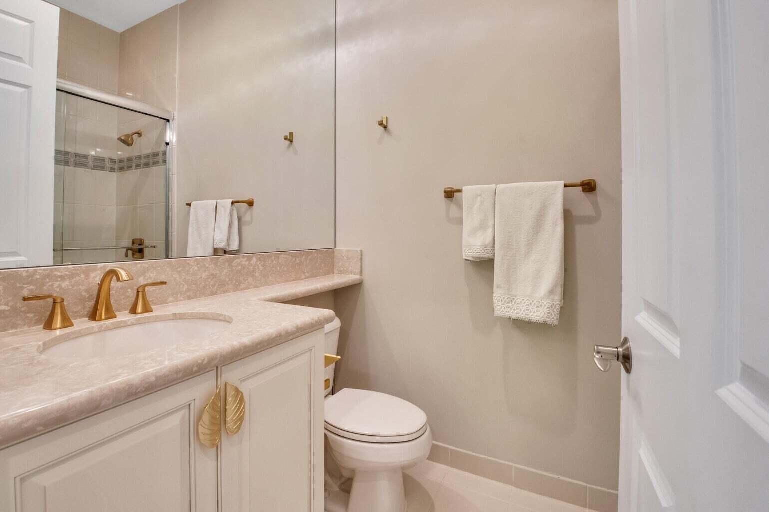 9016 Chauvet Way Boca Raton, FL 33496 - Photo 31 of 79 a bathroom with a granite countertop sink toilet and shower