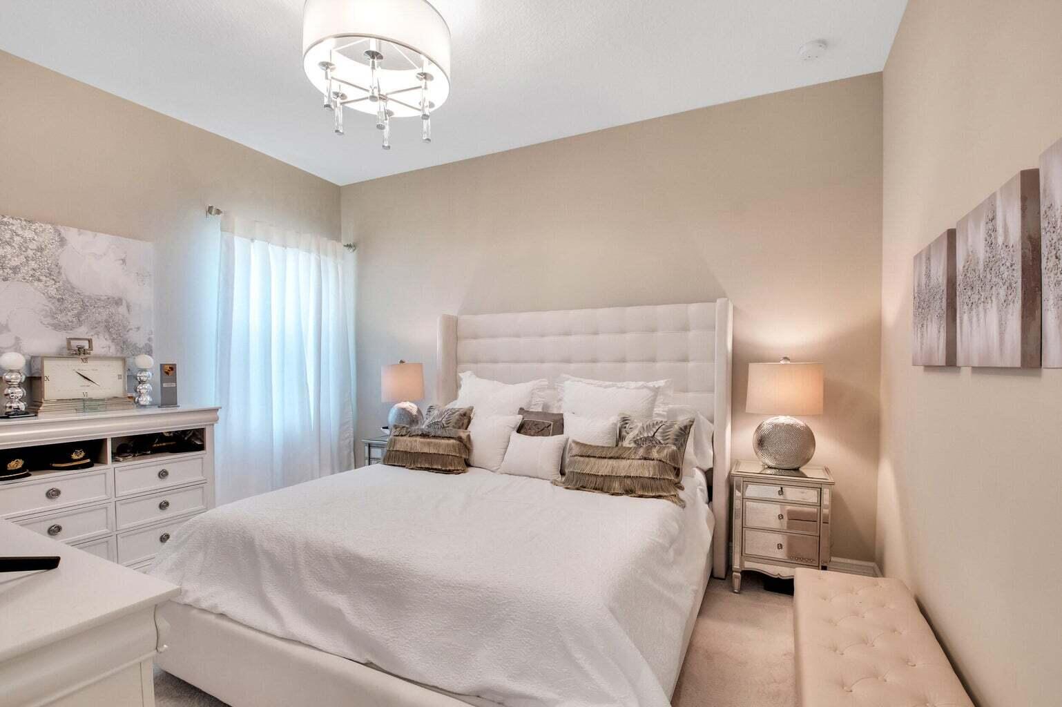 9016 Chauvet Way Boca Raton, FL 33496 - Photo 32 of 79 a bedroom with a bed and a chandelier