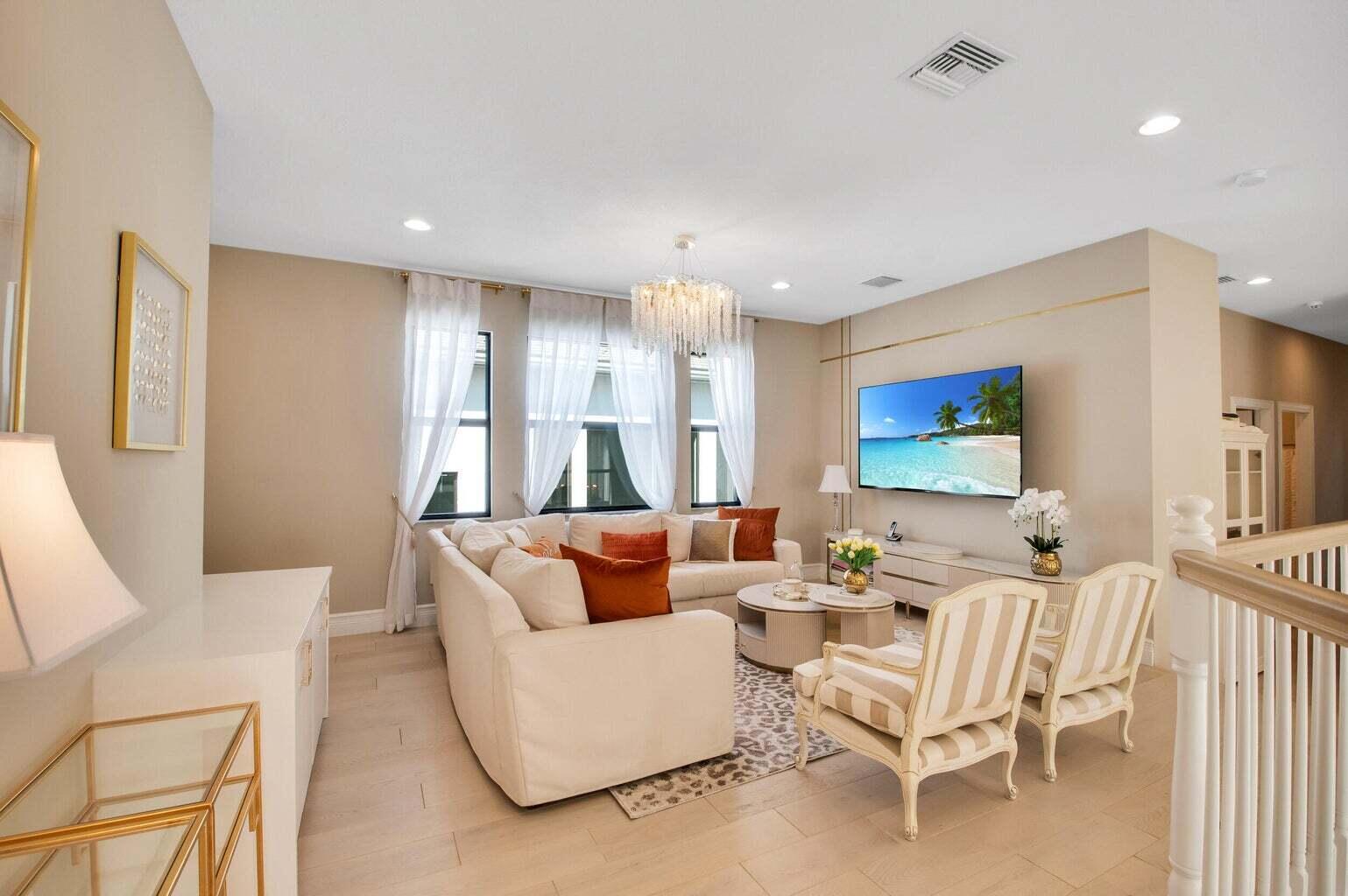 9016 Chauvet Way Boca Raton, FL 33496 - Photo 35 of 79 a living room with furniture and a flat screen tv
