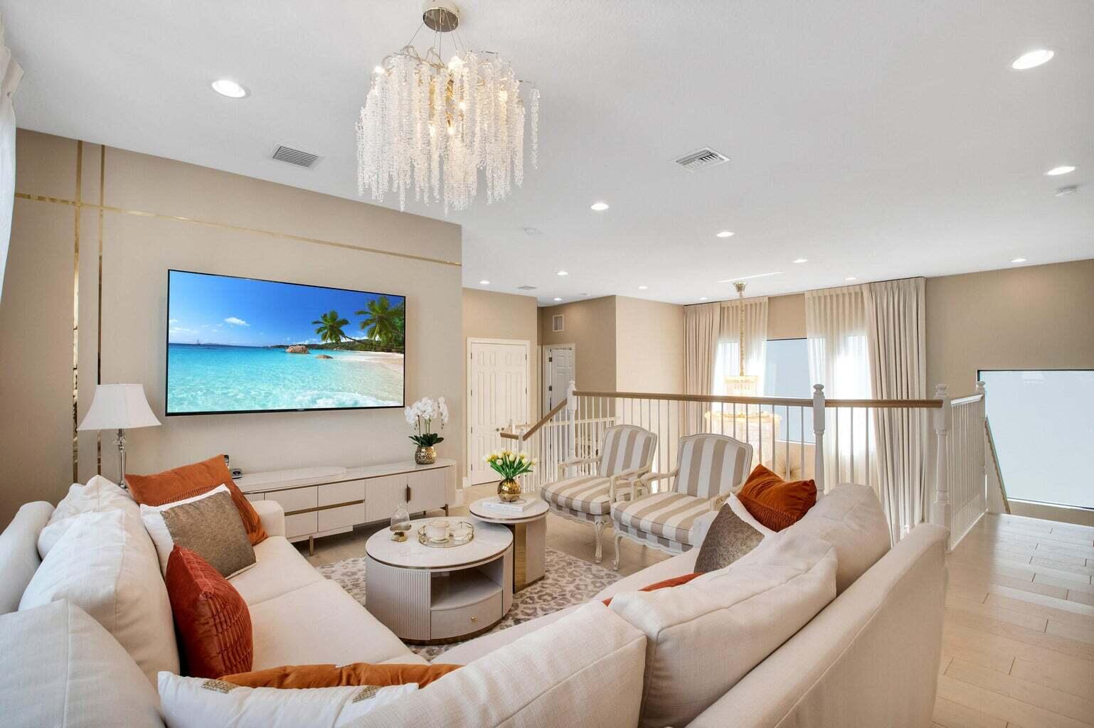 9016 Chauvet Way Boca Raton, FL 33496 - Photo 36 of 79 a living room with furniture and a chandelier